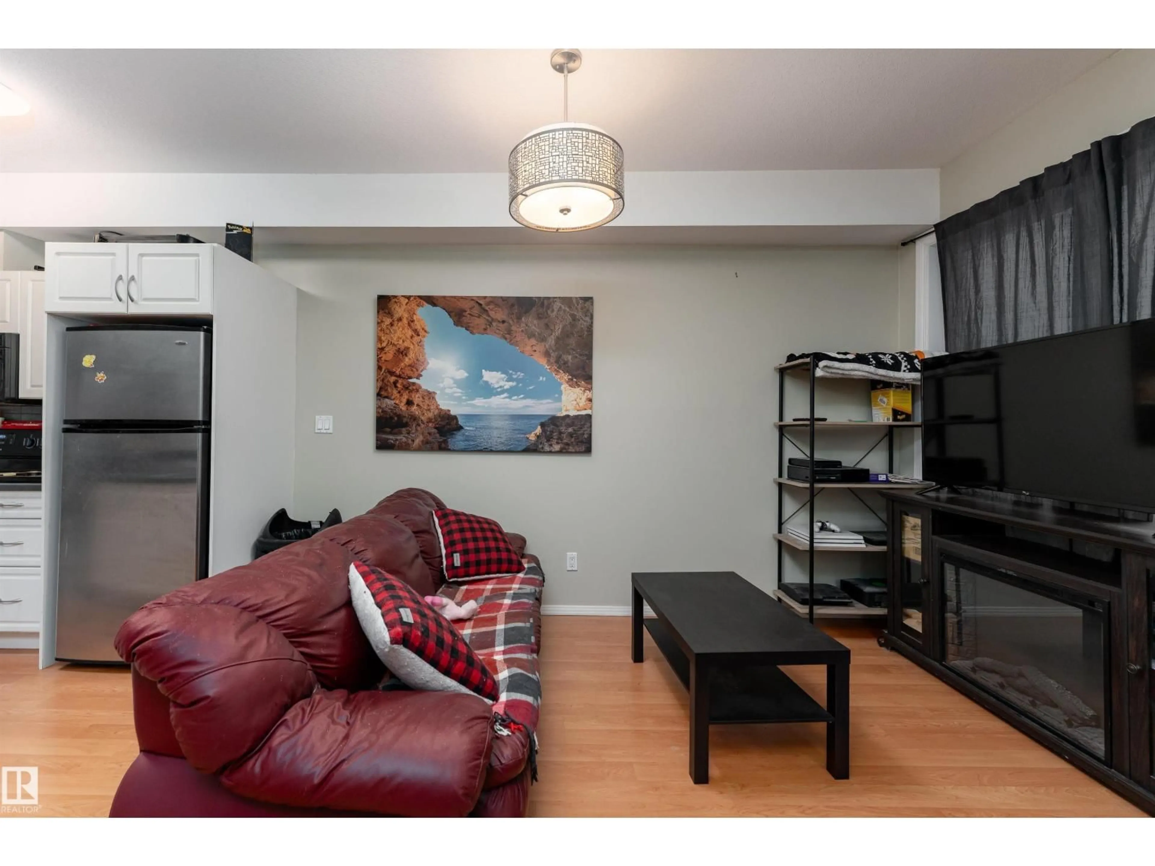 Living room with furniture, wood/laminate floor for #104 - 11933 106 AV, Edmonton Alberta T5H0S2