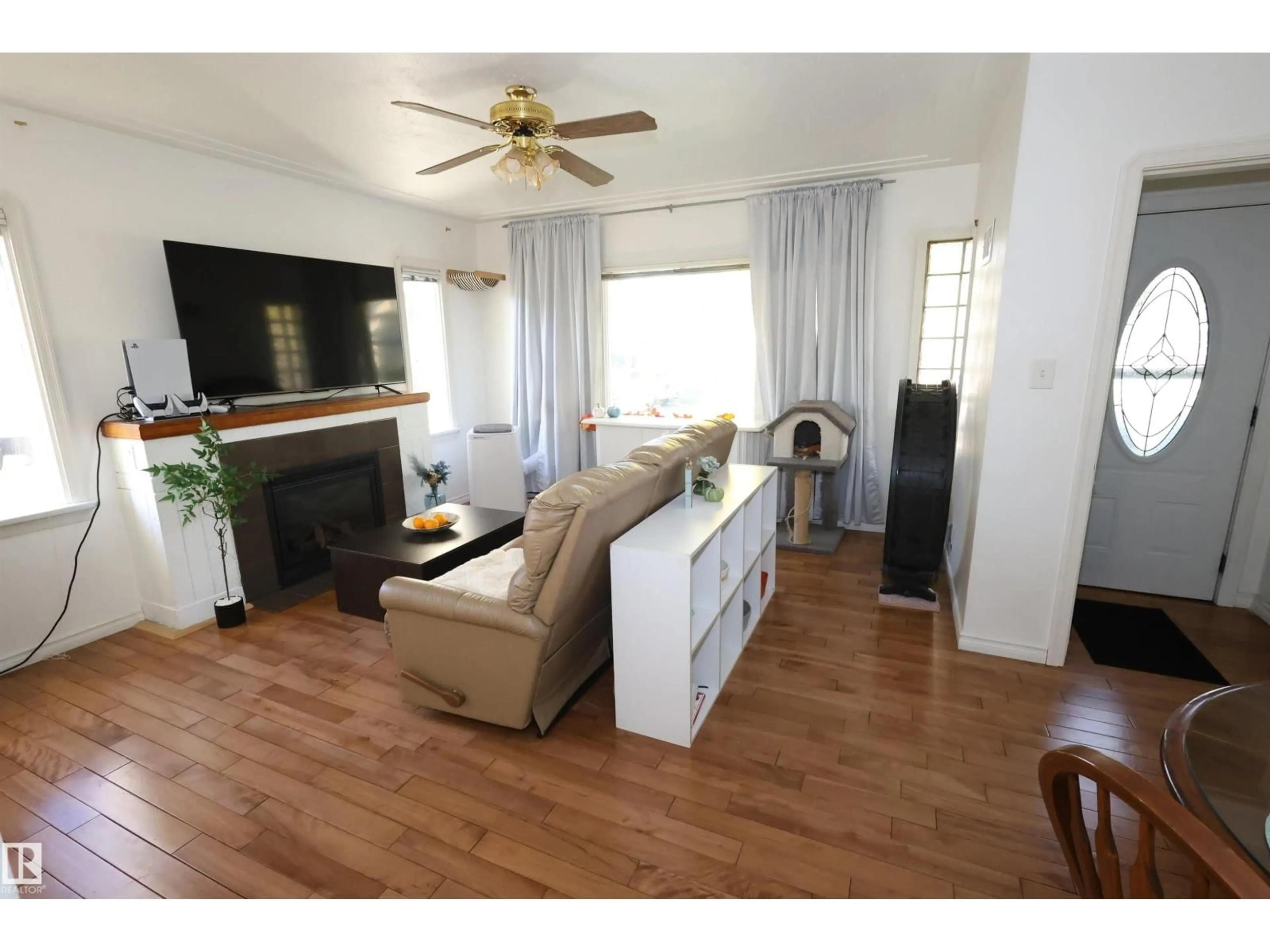 Living room with furniture, wood/laminate floor for NW - 12229 88 ST, Edmonton Alberta T5B3S7