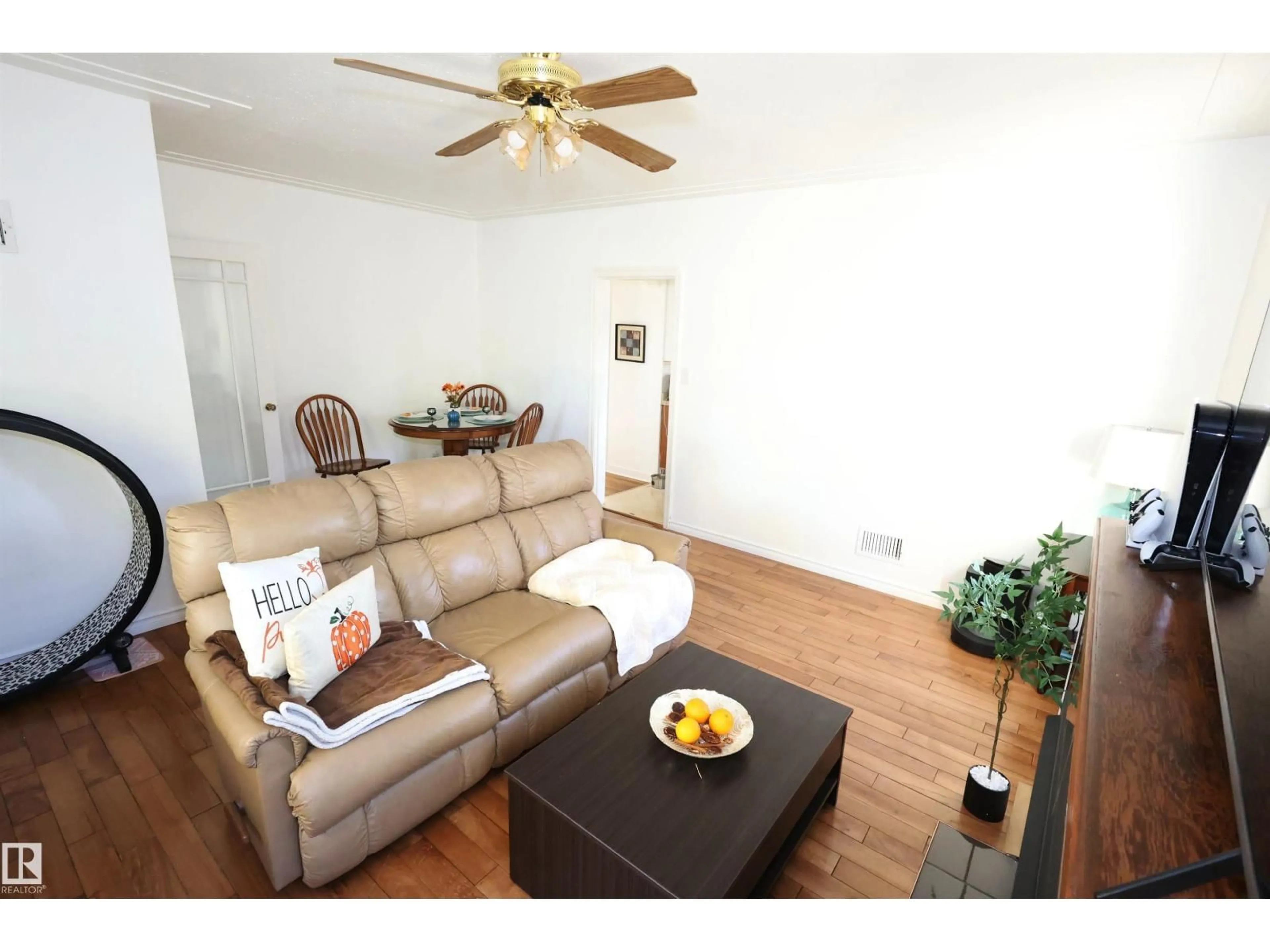 Living room with furniture, wood/laminate floor for NW - 12229 88 ST, Edmonton Alberta T5B3S7