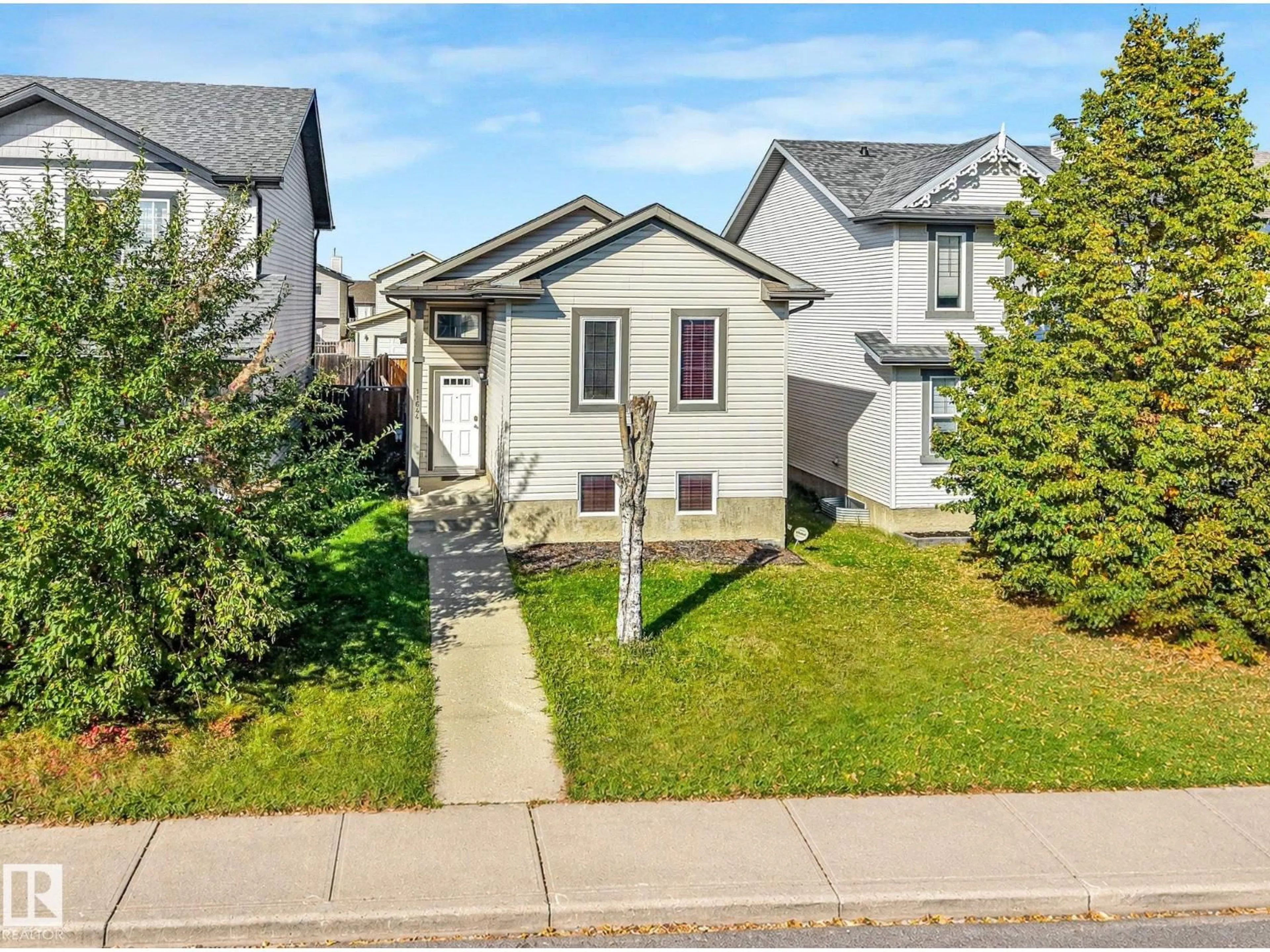 Home with vinyl exterior material, street for 11644 167A AV, Edmonton Alberta T5X6J5