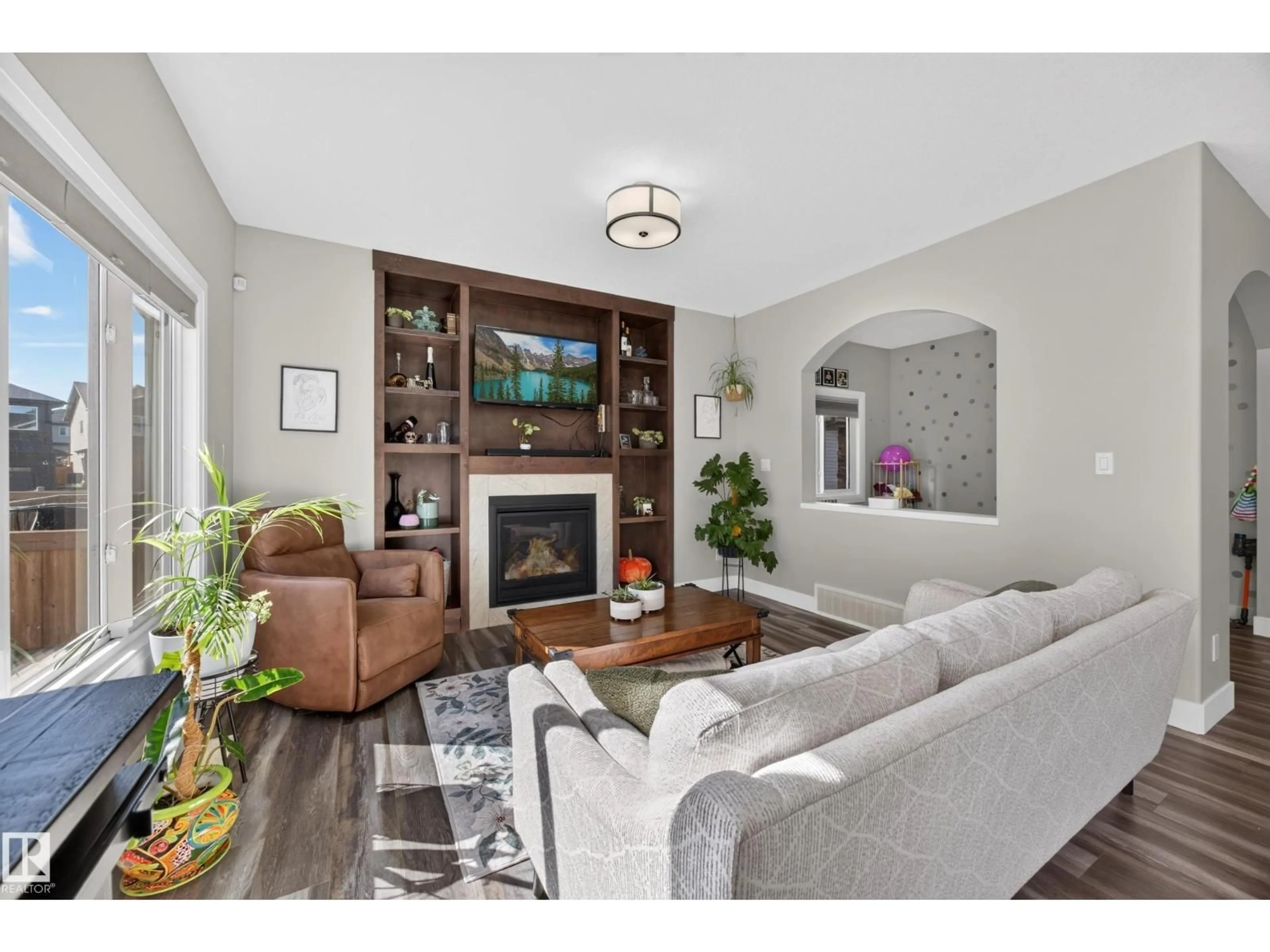 Living room with furniture, wood/laminate floor for SW SW - 6347 CRAWFORD LI, Edmonton Alberta T6W3Y6