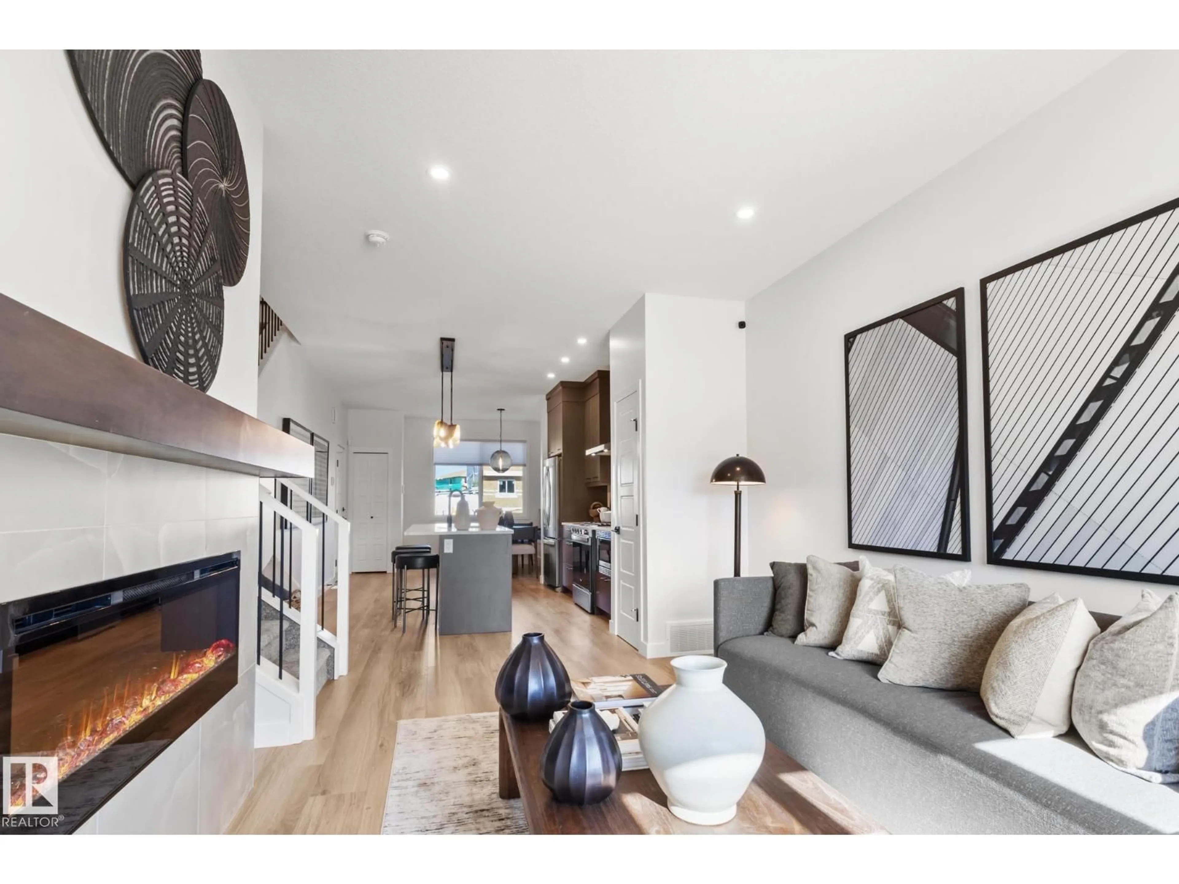 Living room with furniture, wood/laminate floor for SW - 12527 34 AV, Edmonton Alberta T6W5Z8