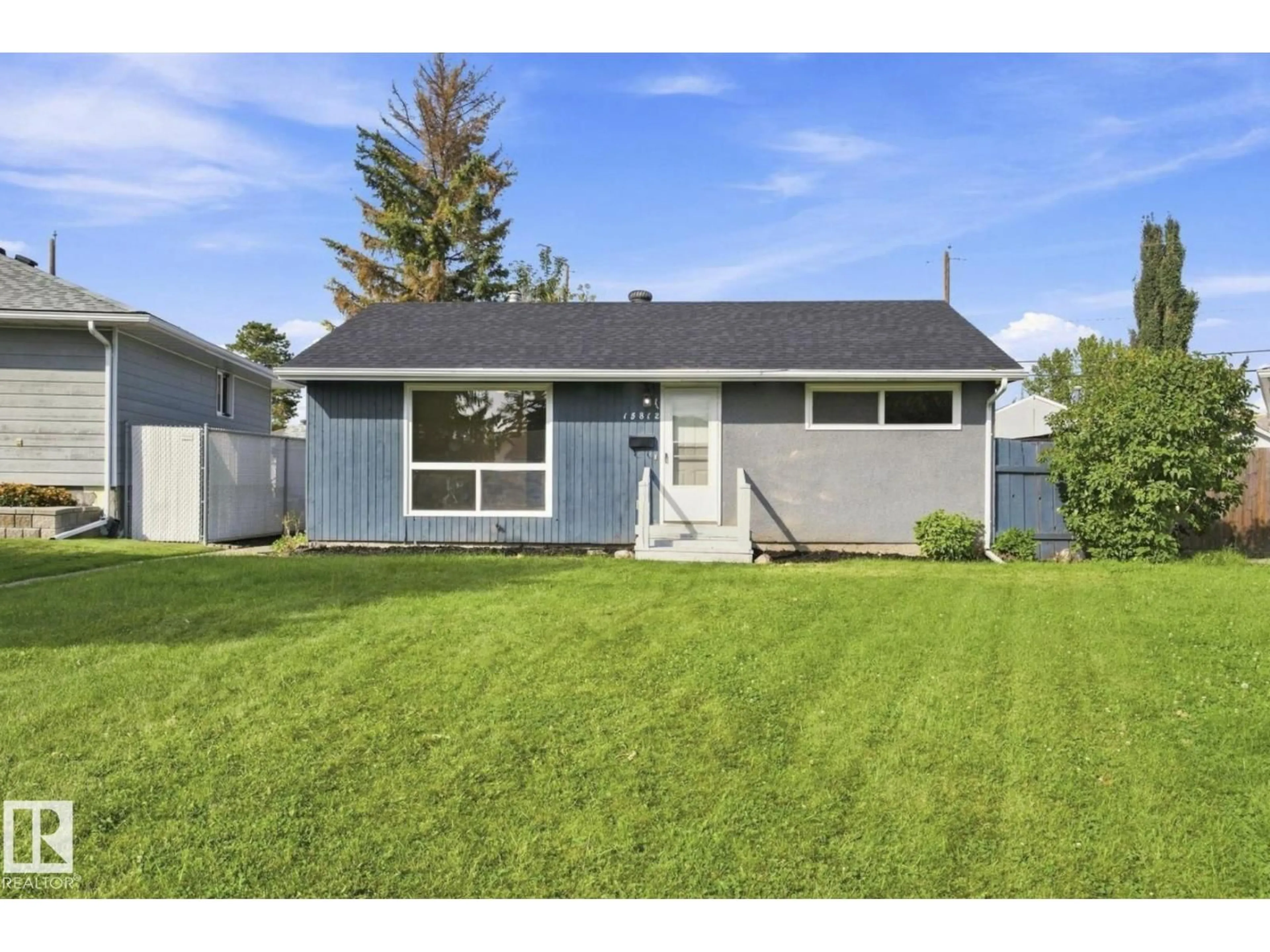 Home with vinyl exterior material, street for 15812 110A AV, Edmonton Alberta T5P1H7