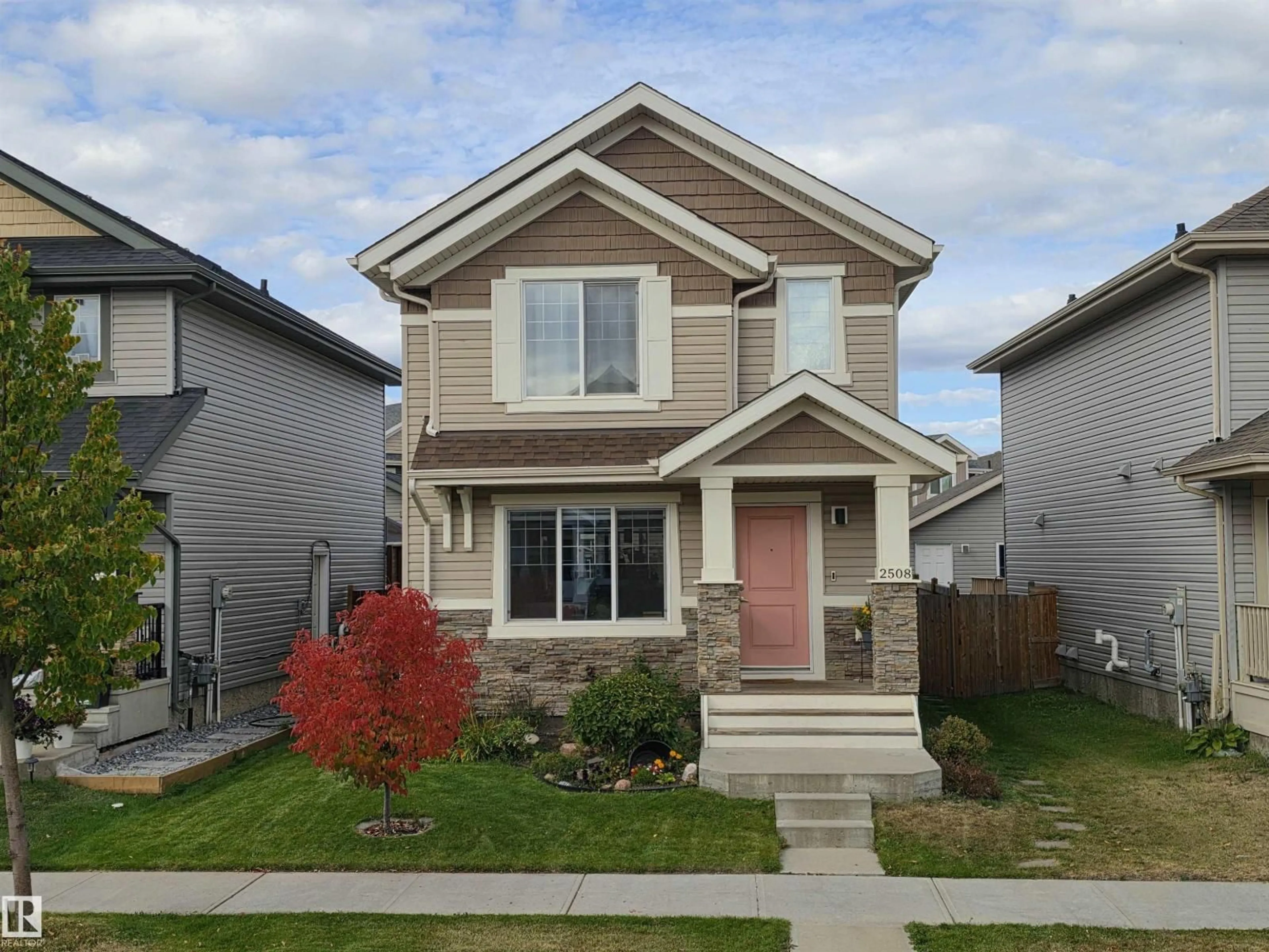 Home with vinyl exterior material, street for 2508 20 AV, Edmonton Alberta T6T0Y7