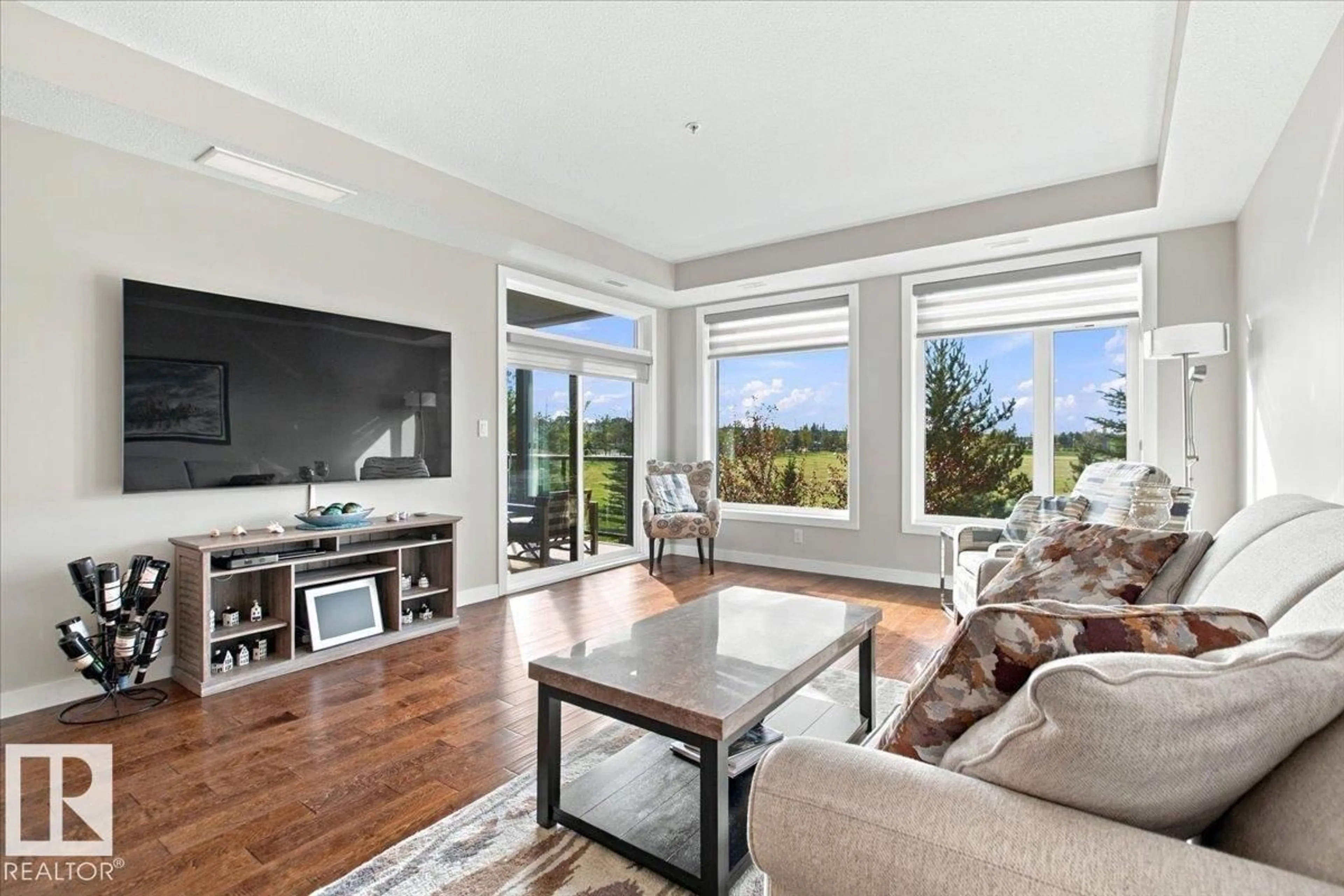 Living room with furniture, unknown for #205 - 625 LEGER WY, Edmonton Alberta T6R0W4
