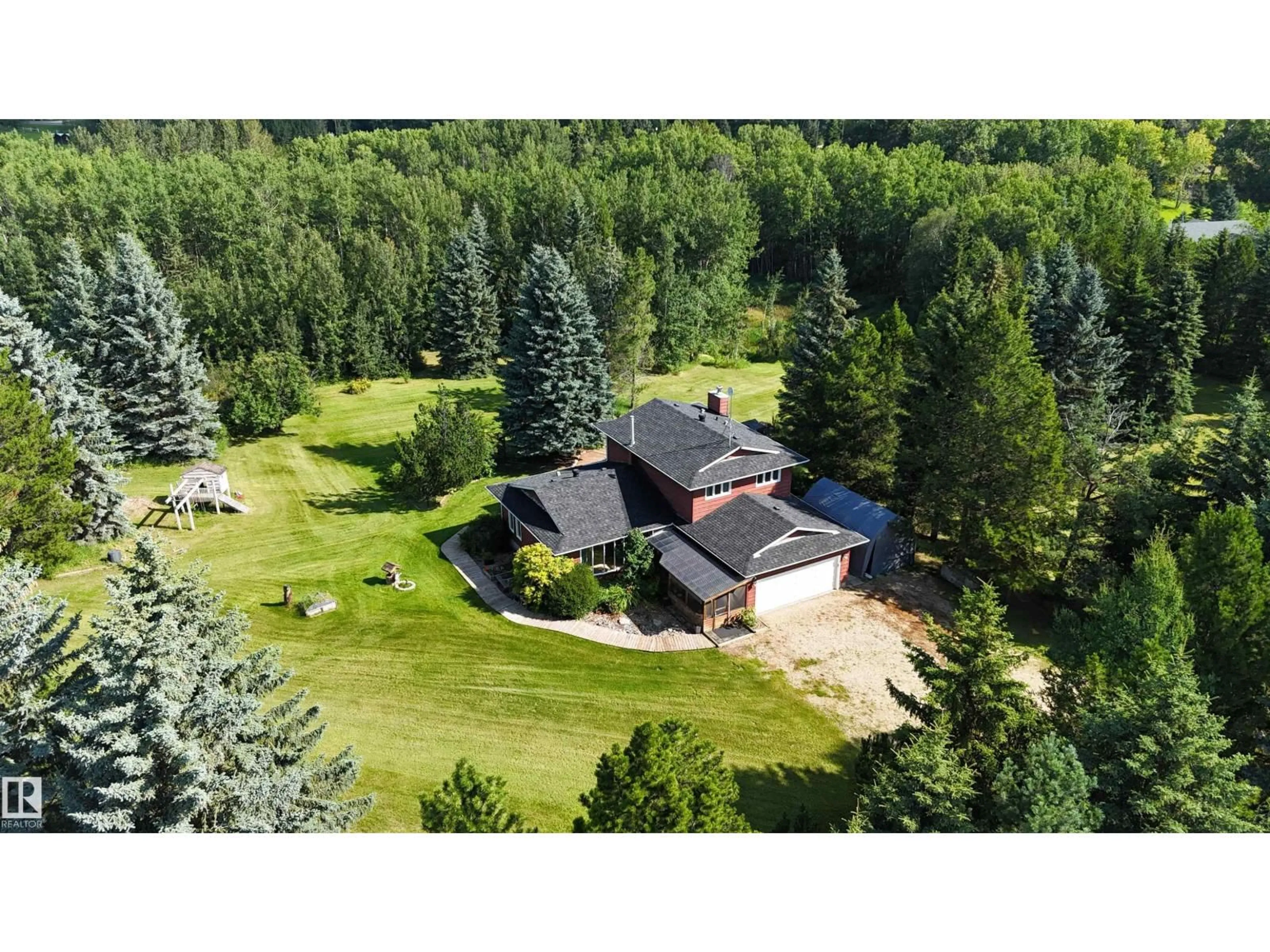 A pic from outside/outdoor area/front of a property/back of a property/a pic from drone, forest/trees view for #6 - 53218 RGE ROAD 14, Rural Parkland County Alberta T7Y0G3