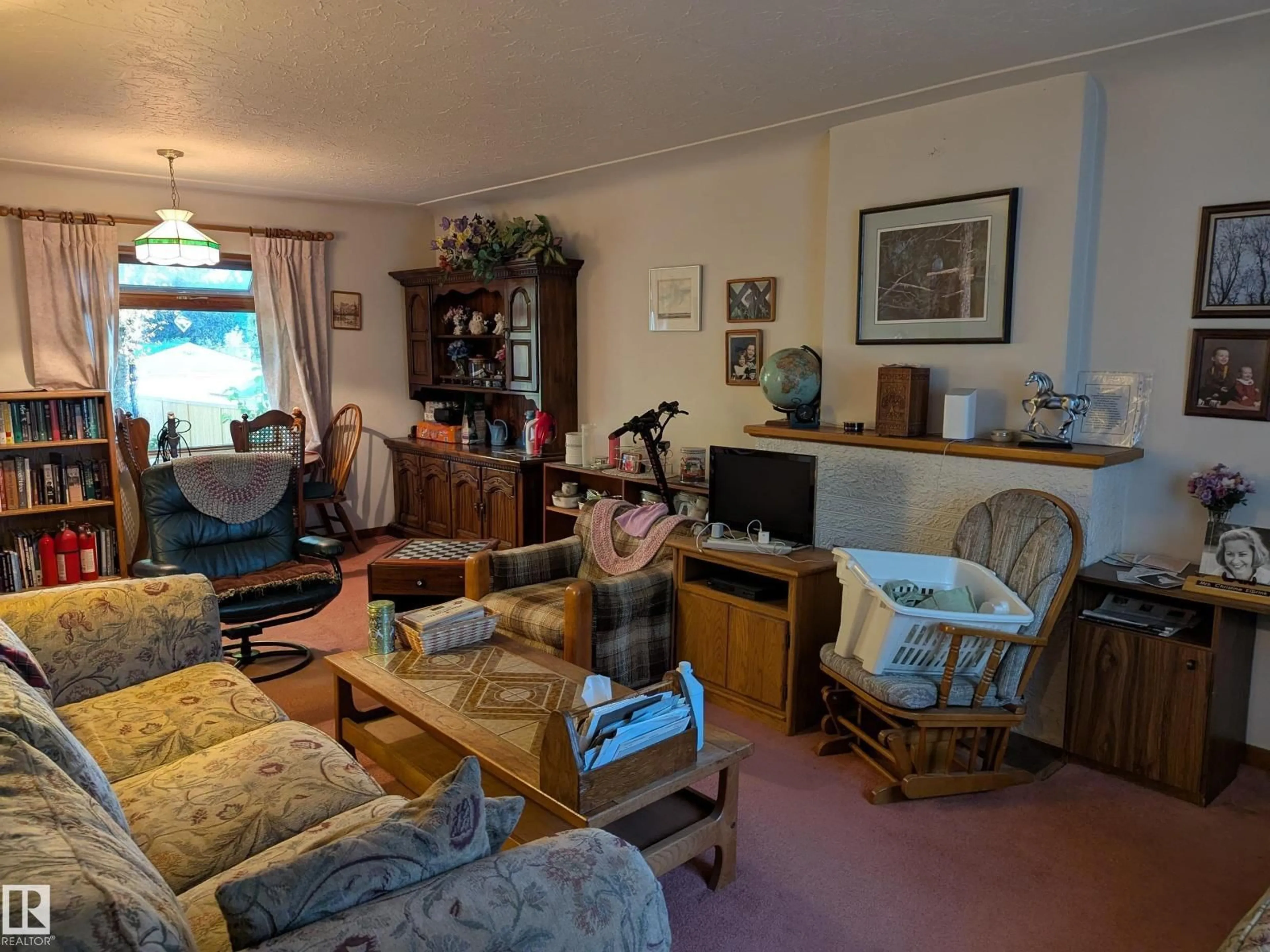 Living room with furniture, unknown for 10965 76 AV, Edmonton Alberta T6G0J6