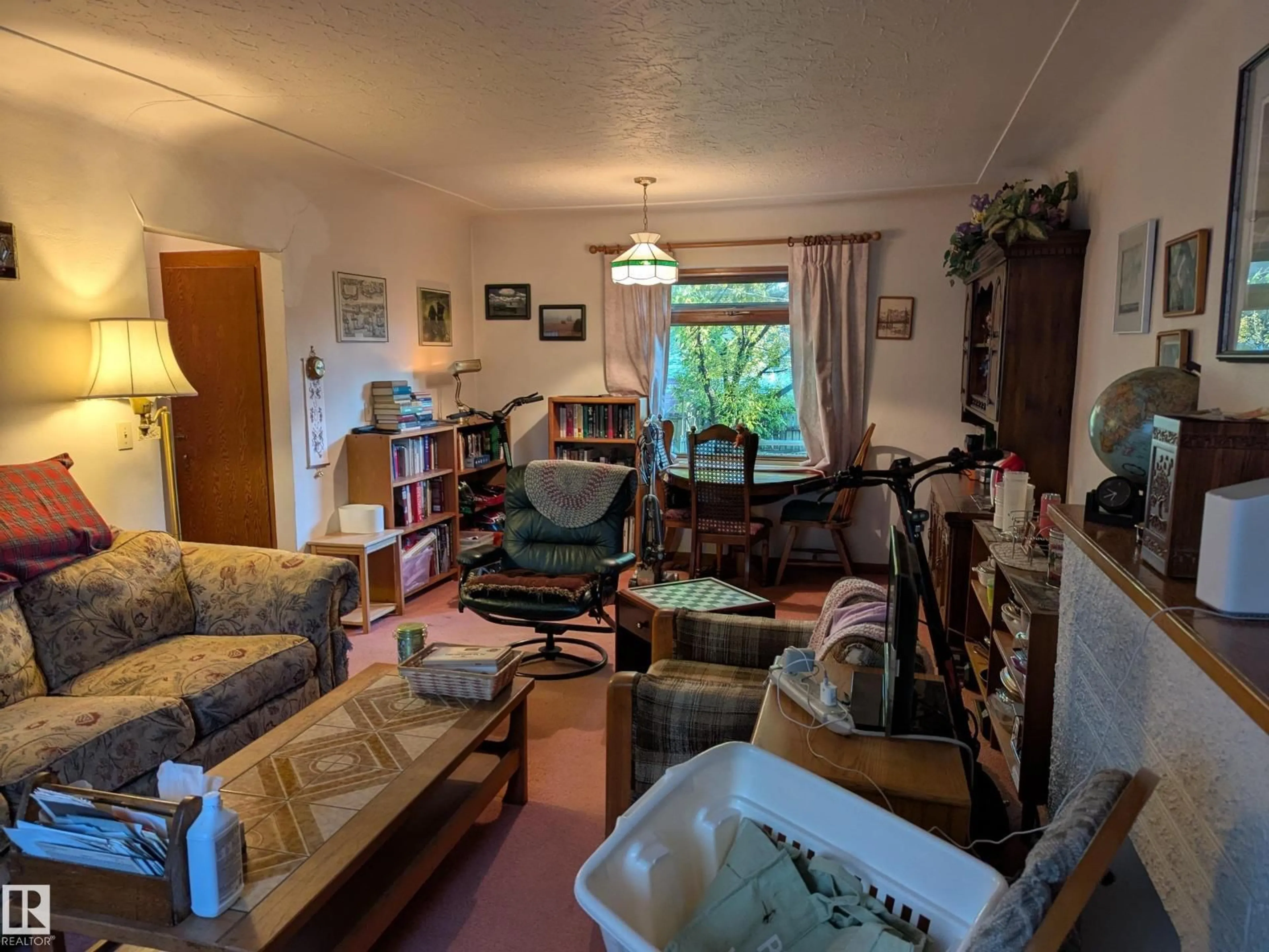 Living room with furniture, unknown for 10965 76 AV, Edmonton Alberta T6G0J6