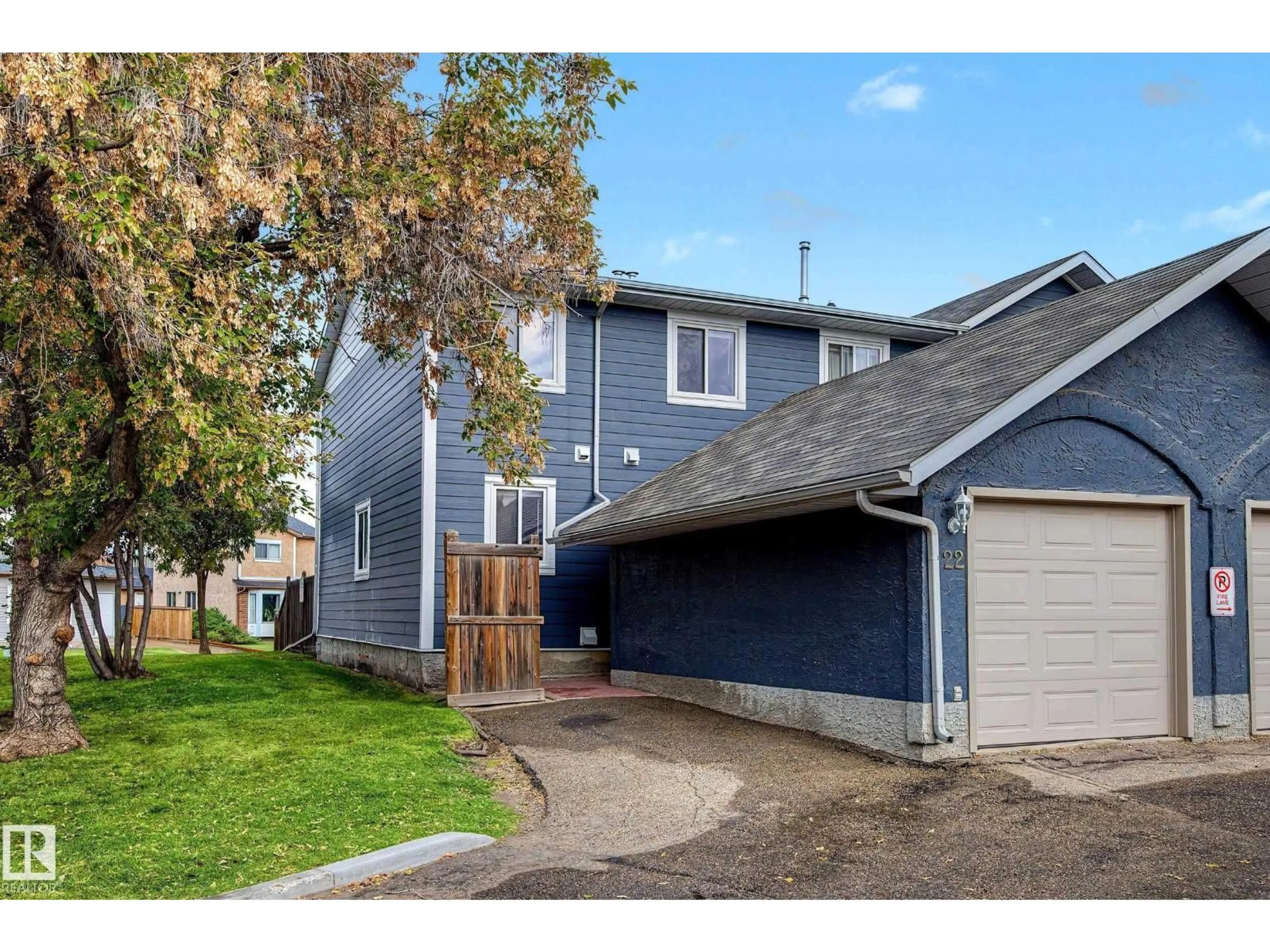 Home with vinyl exterior material, street for #22 - 14803 34 ST, Edmonton Alberta T5Y2L3