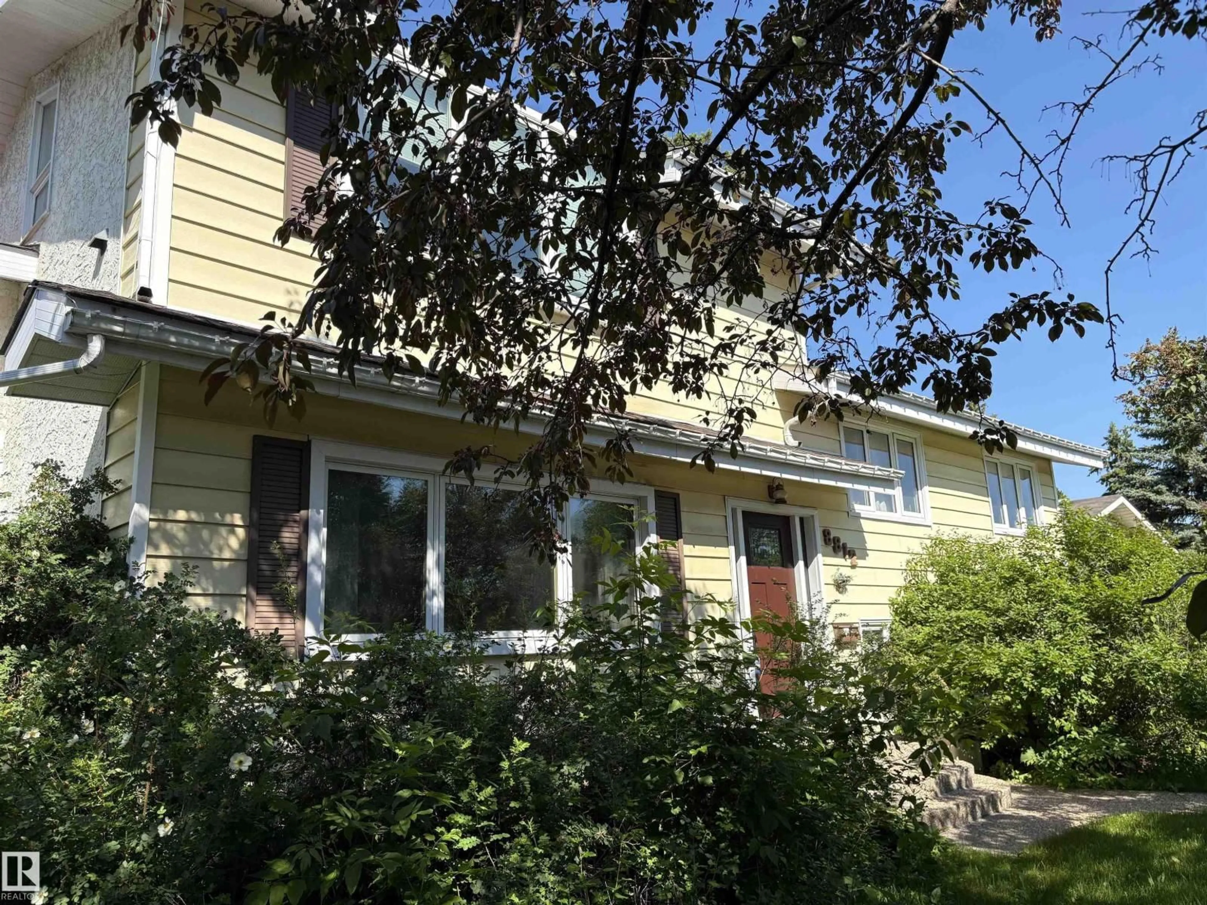 Home with vinyl exterior material, street for NW - 8812 146 ST, Edmonton Alberta T5R0V6