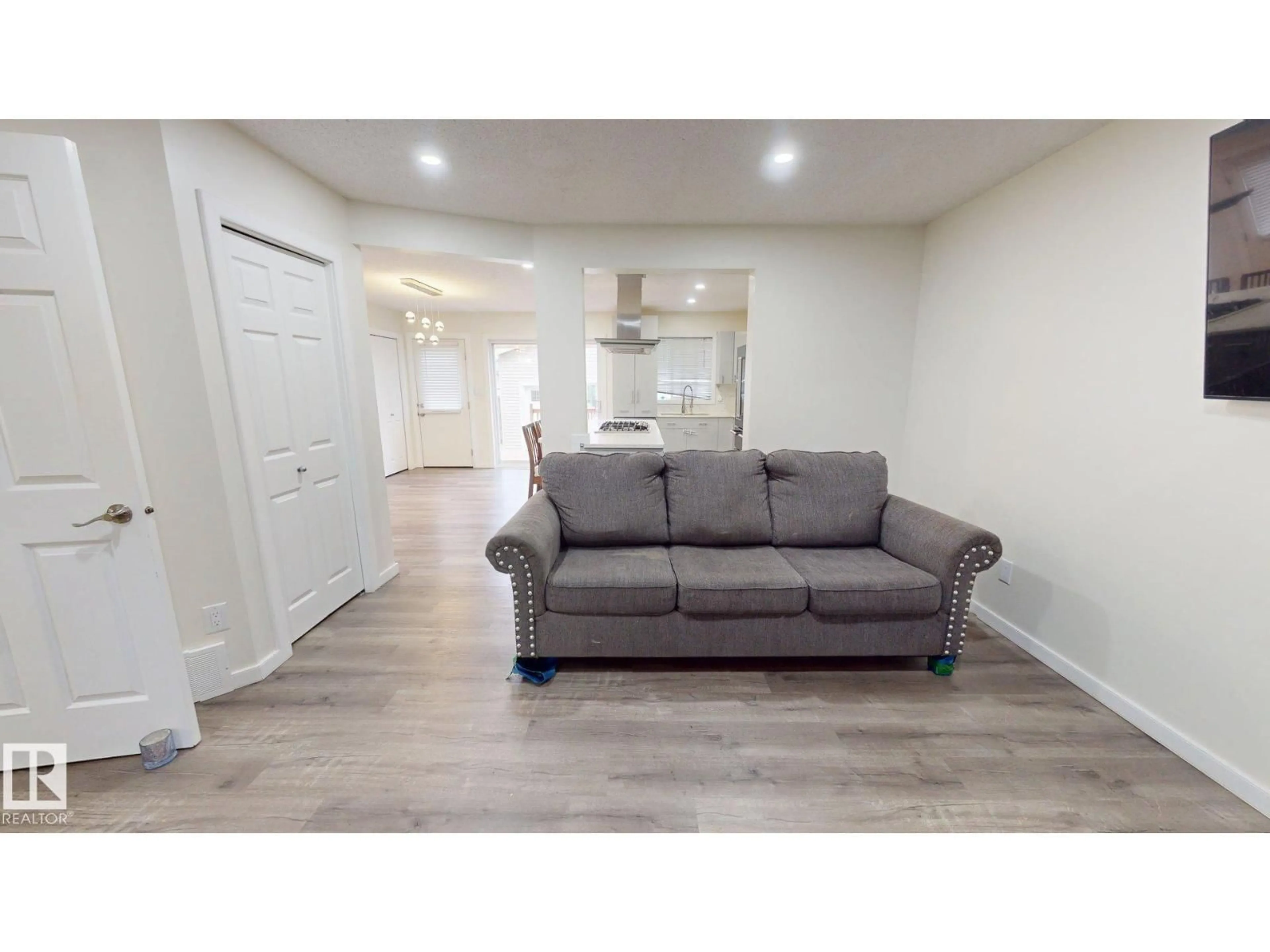 Living room with furniture, wood/laminate floor for 17 VISTA, Spruce Grove Alberta T7X4P6
