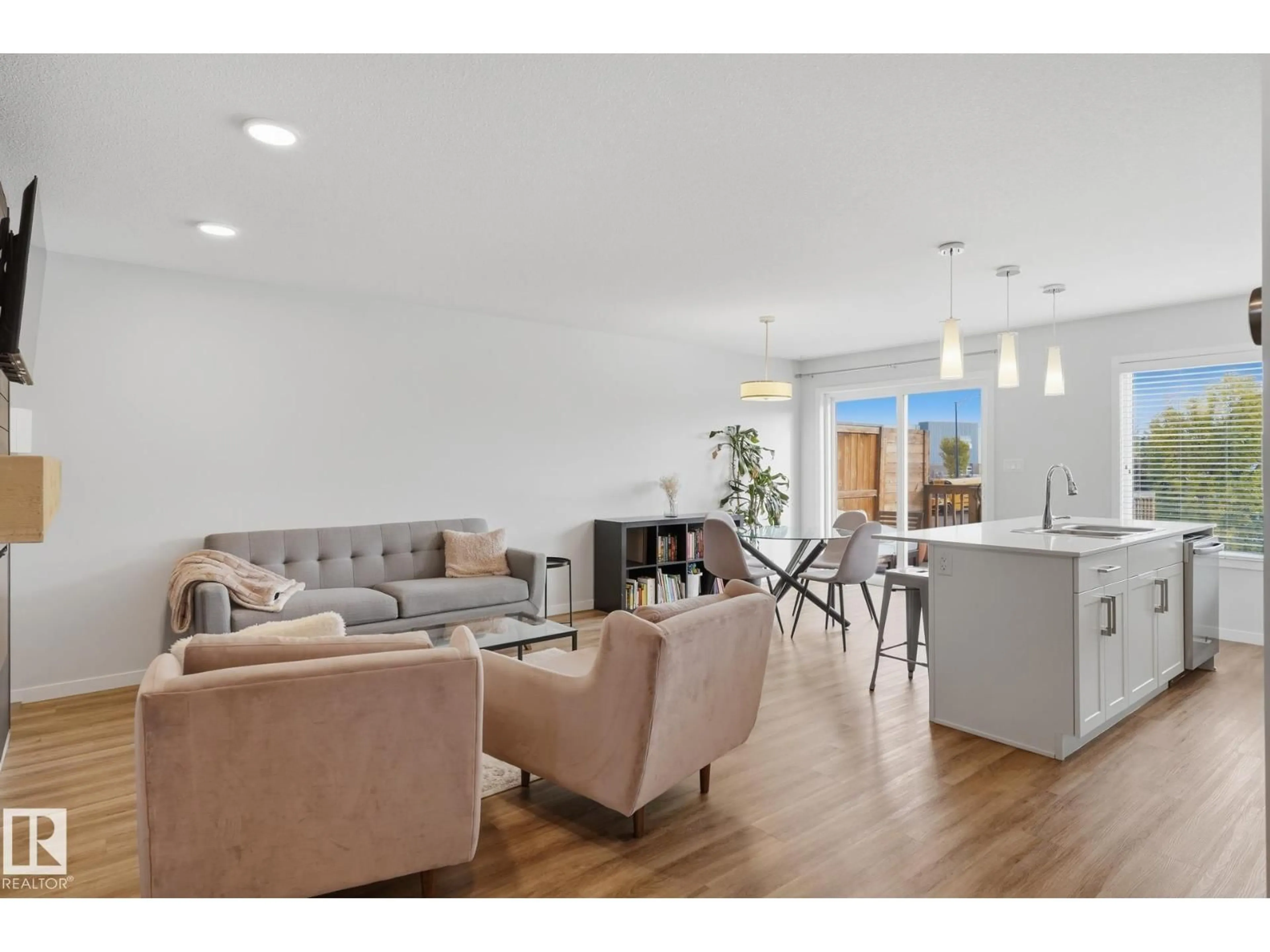Living room with furniture, wood/laminate floor for SW - 2205 82 ST, Edmonton Alberta T6X2J6