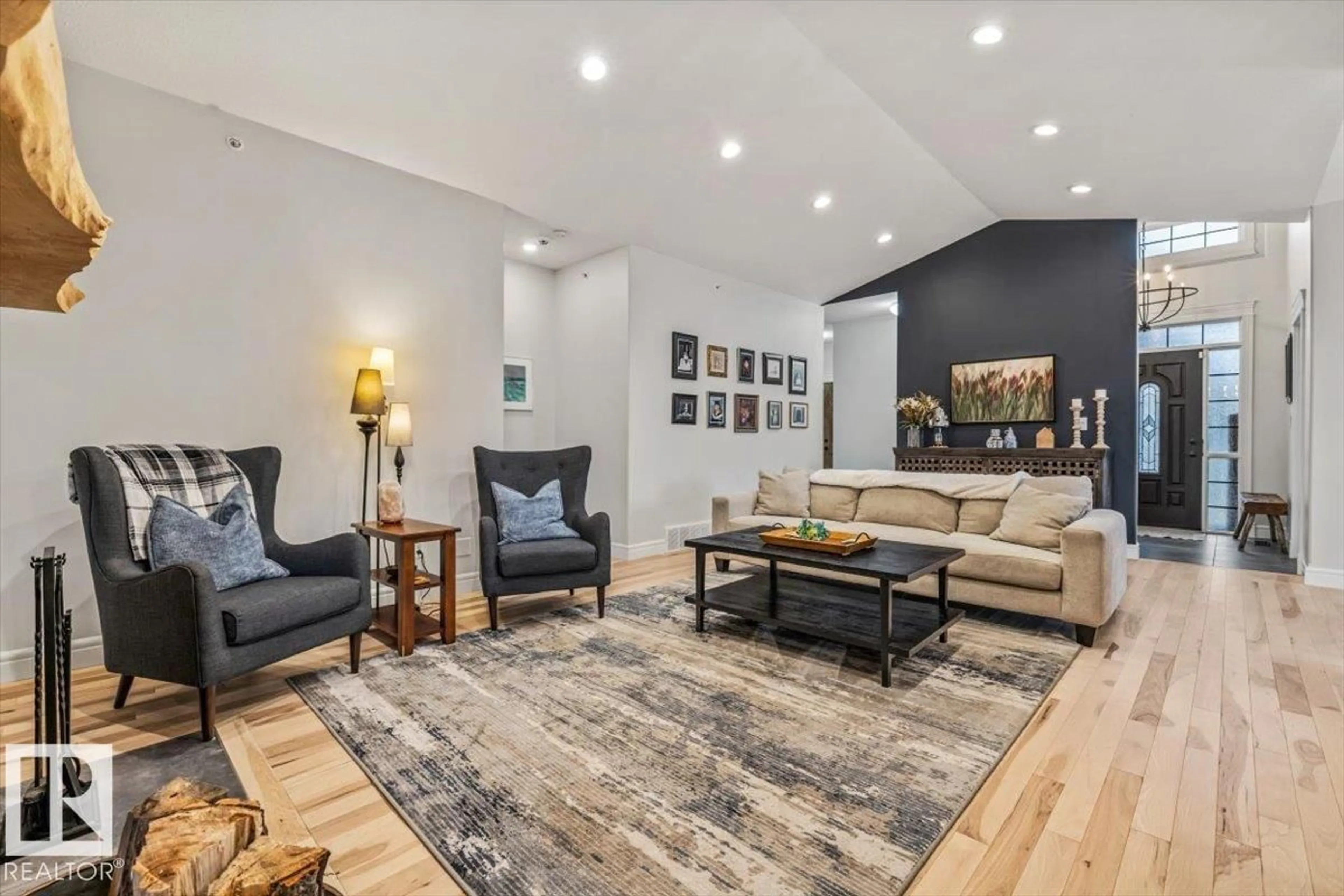 Living room with furniture, wood/laminate floor for 12 51025 RGE ROAD 222, Rural Strathcona County Alberta T8C1J5