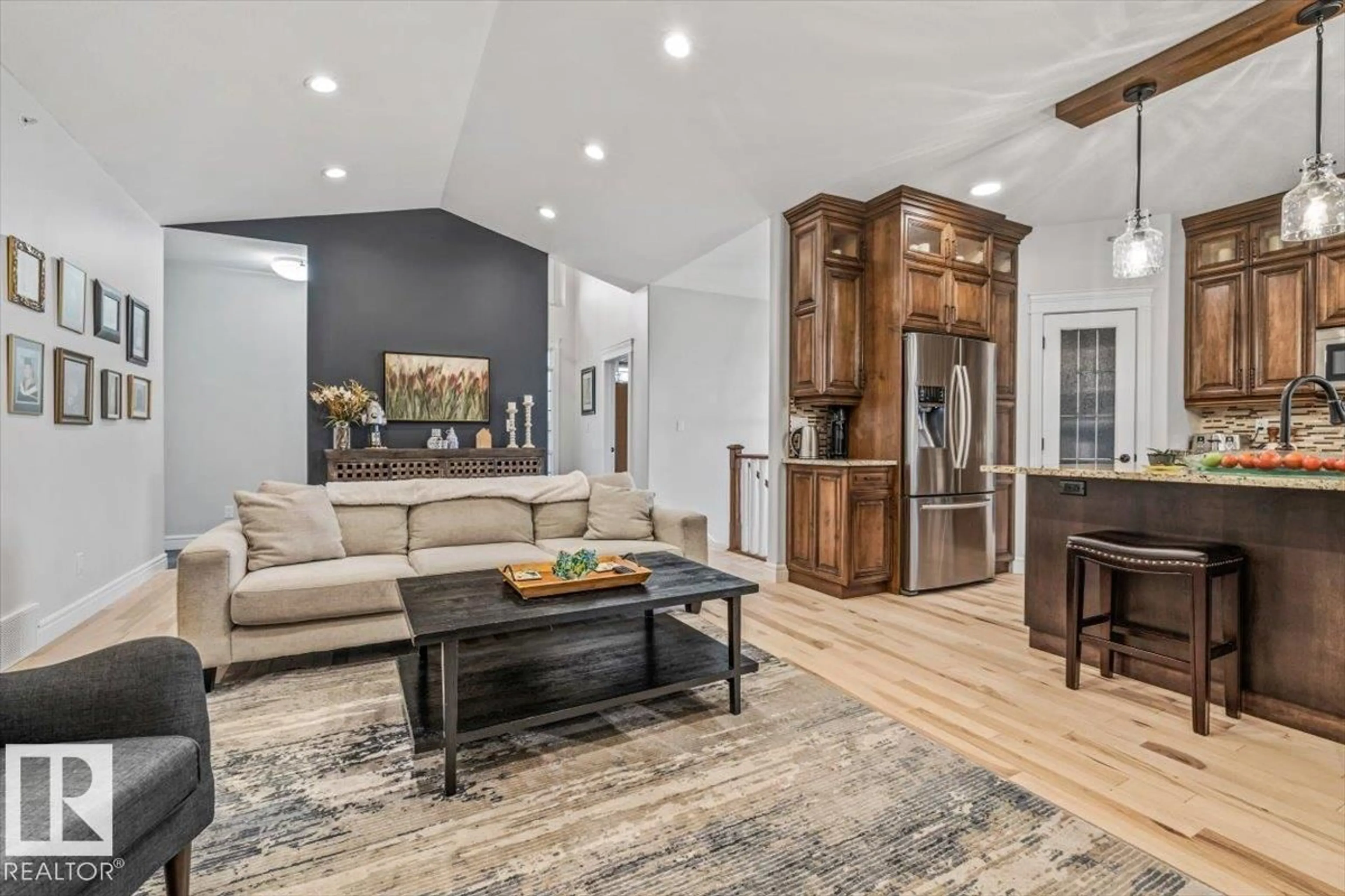 Living room with furniture, wood/laminate floor for 12 51025 RGE ROAD 222, Rural Strathcona County Alberta T8C1J5