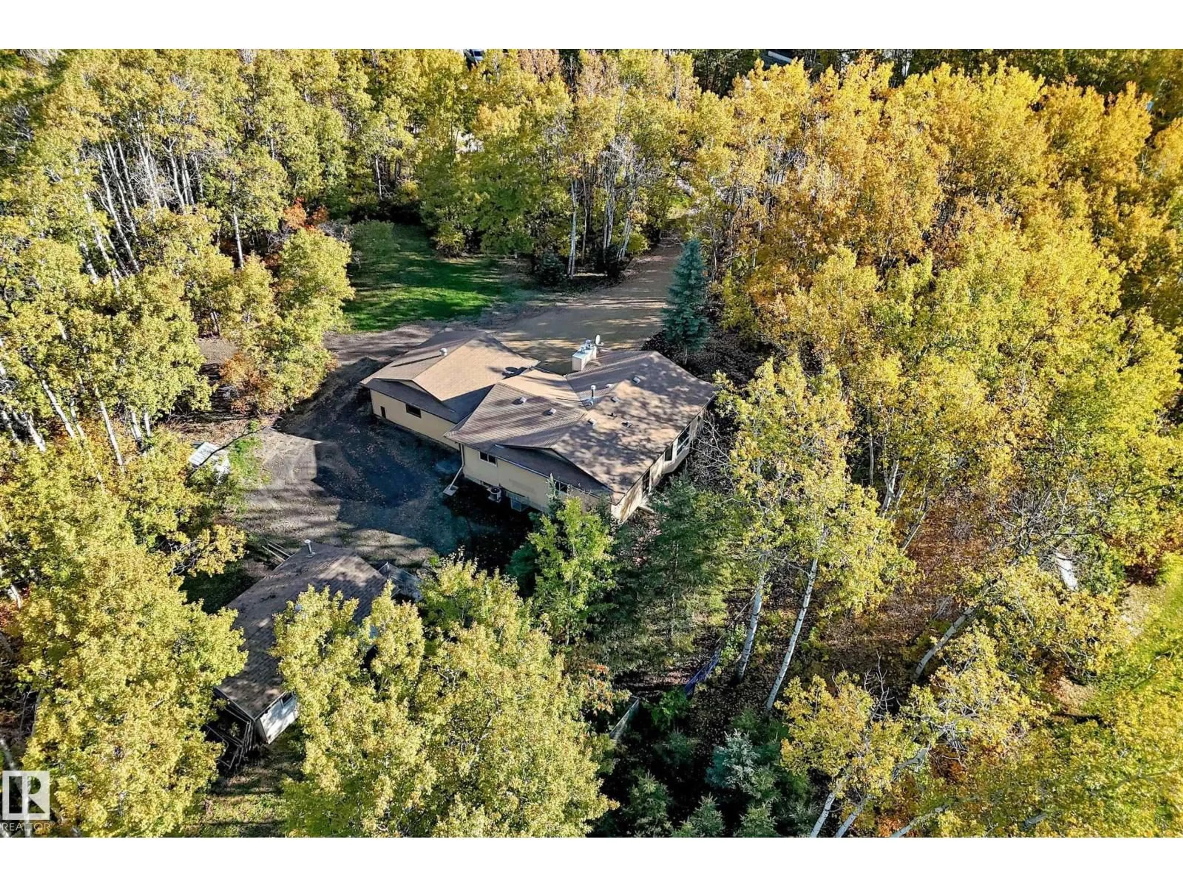A pic from outside/outdoor area/front of a property/back of a property/a pic from drone, forest/trees view for #100 - 23016 TWP RD 504, Rural Leduc County Alberta T0B3M1