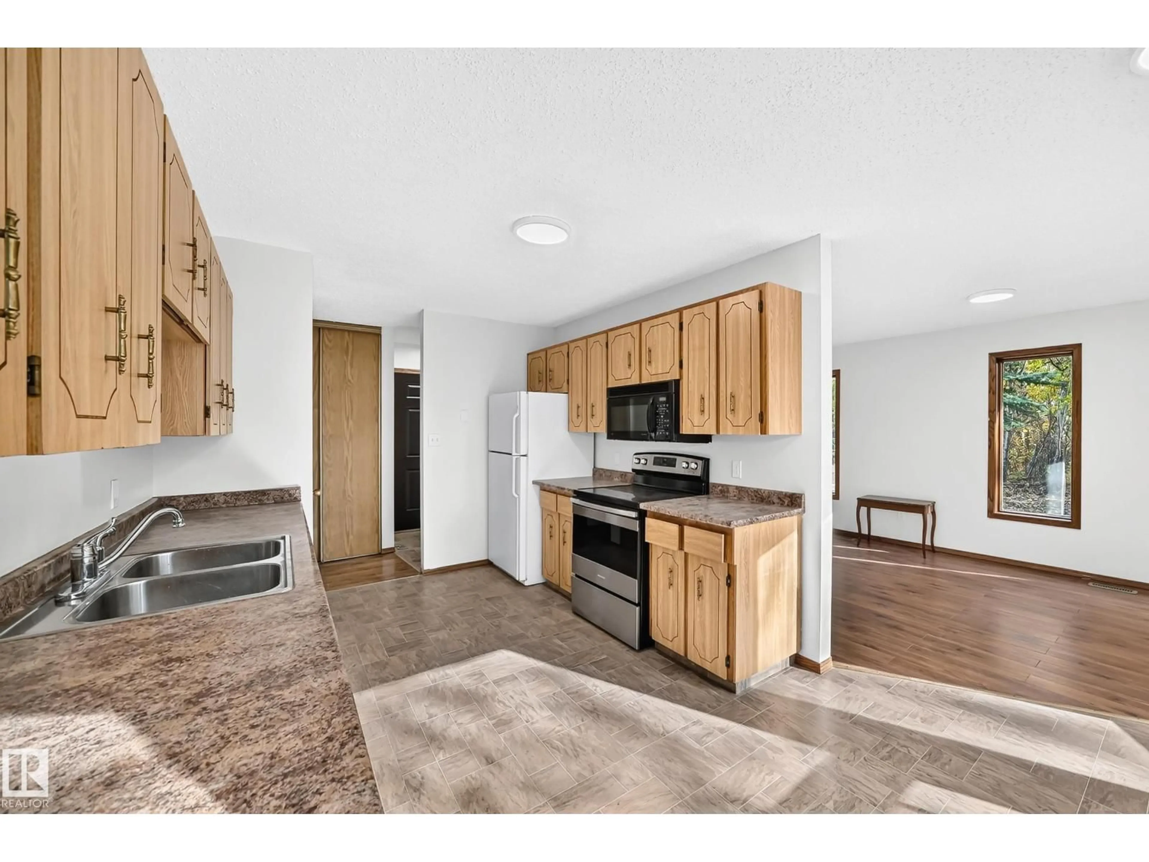 Open concept kitchen, unknown for #100 - 23016 TWP RD 504, Rural Leduc County Alberta T0B3M1