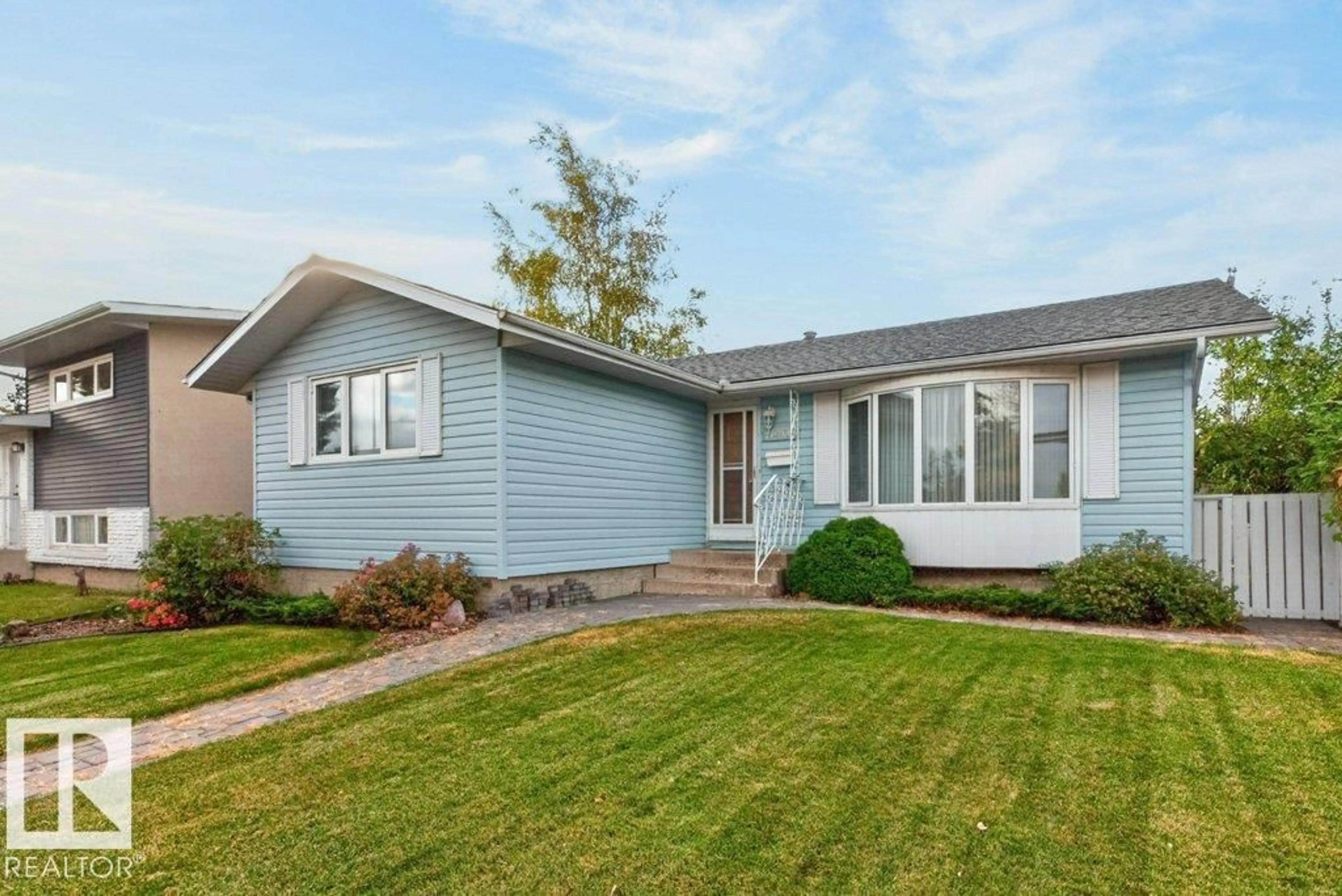 Home with vinyl exterior material, street for 11407 51 AV, Edmonton Alberta T6H0L8