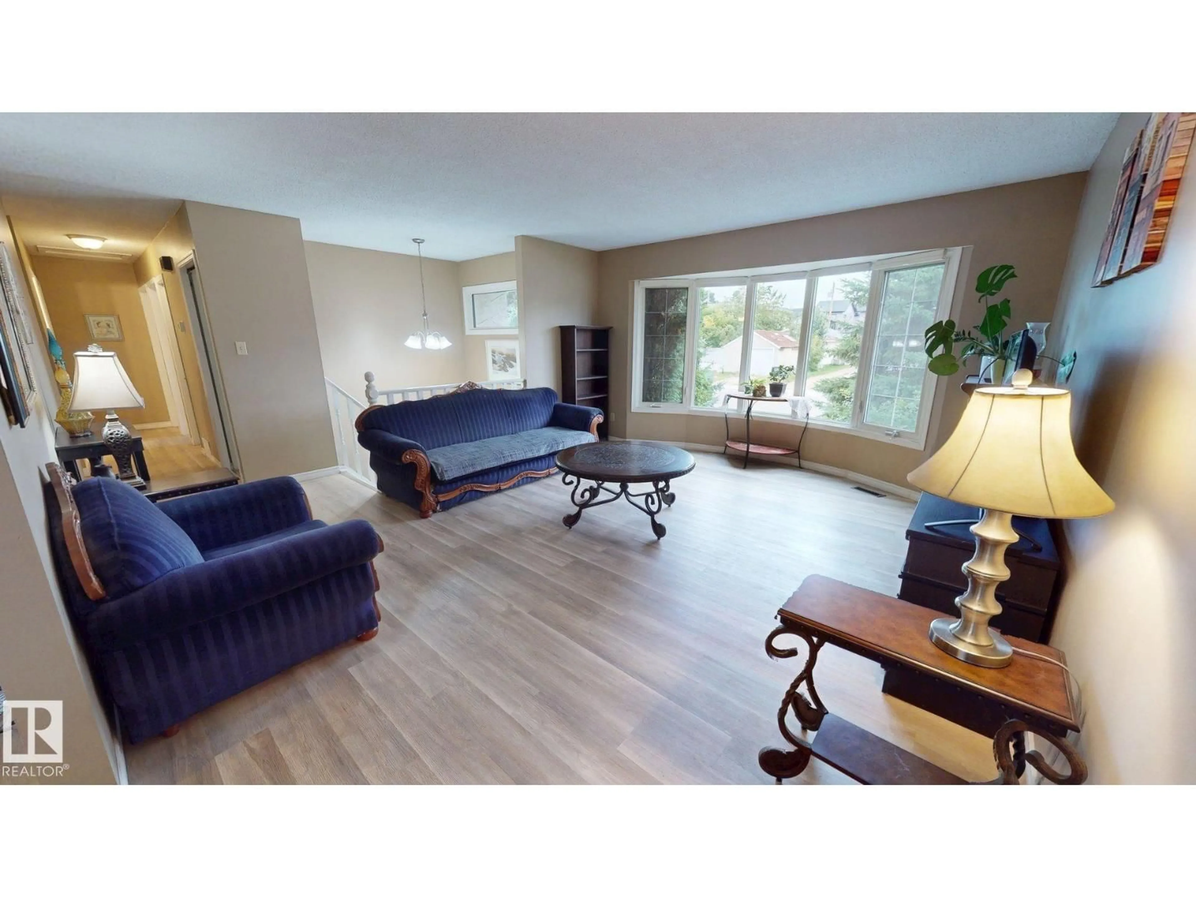 Living room with furniture, wood/laminate floor for 9813 152 ST, Edmonton Alberta T5P1X2