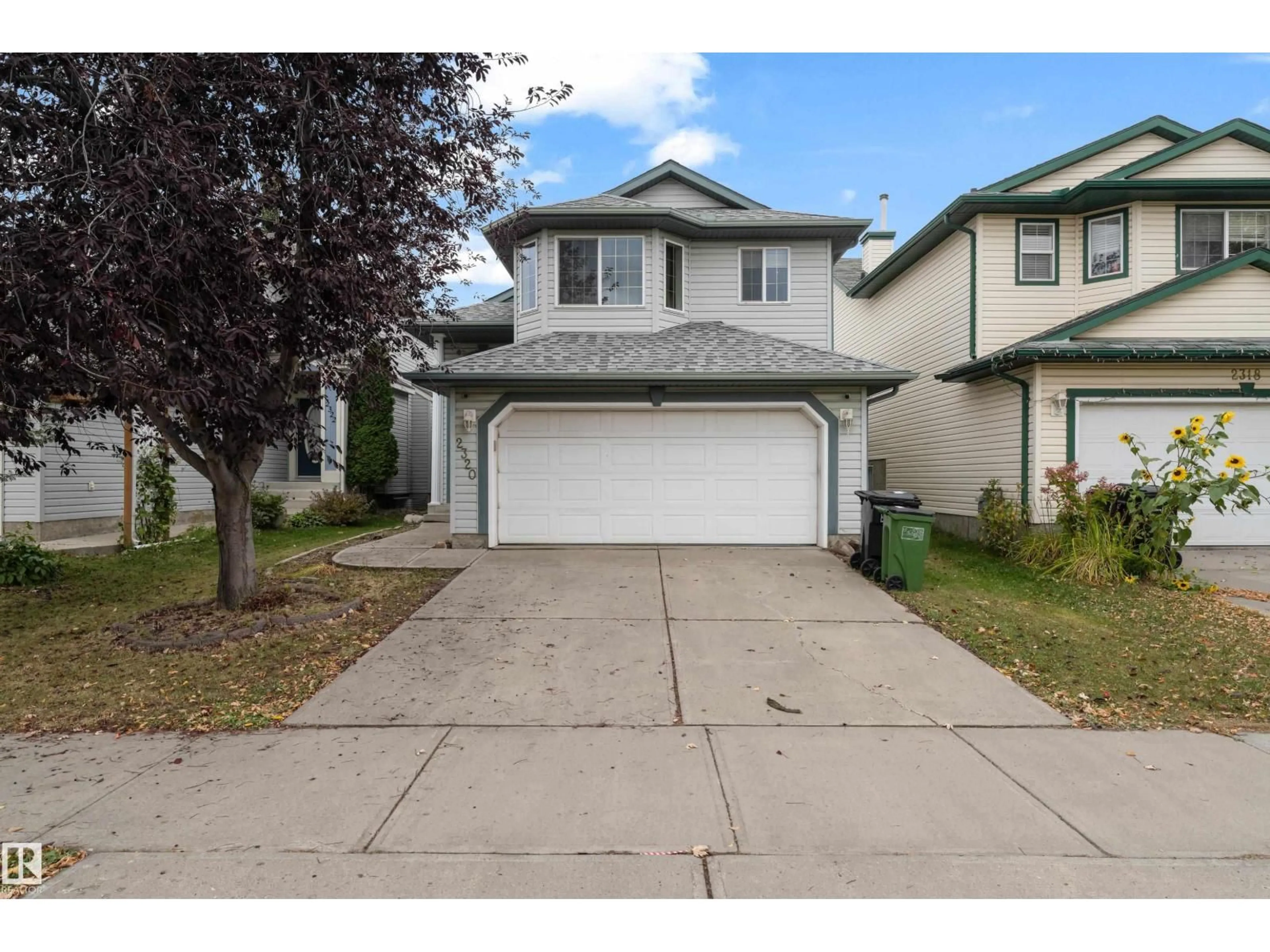 Home with vinyl exterior material, street for 2320 37A AVE AVE, Edmonton Alberta T6T1P4