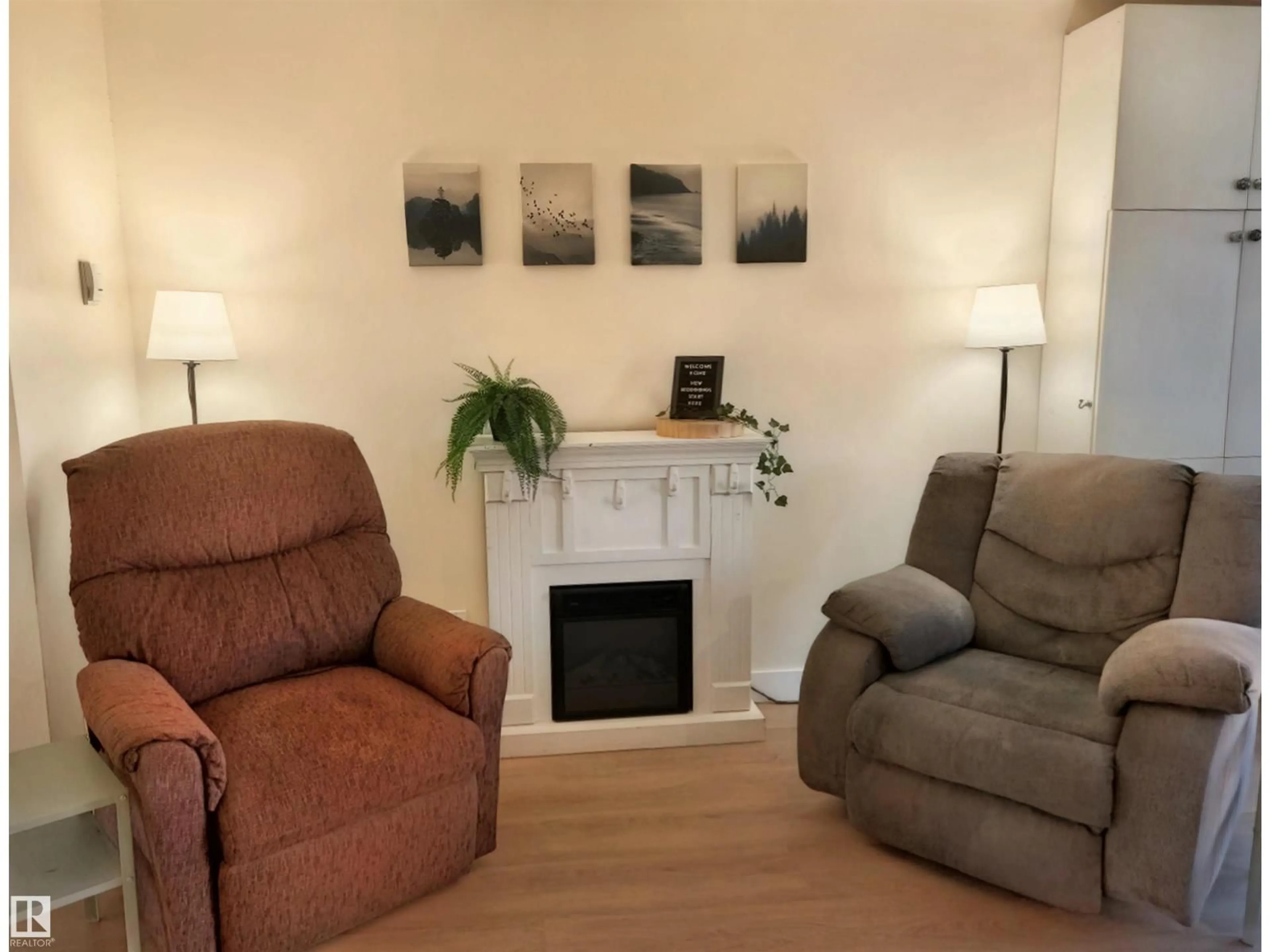 Living room with furniture, wood/laminate floor for 109 - 18204 93 AV, Edmonton Alberta T5T2V2
