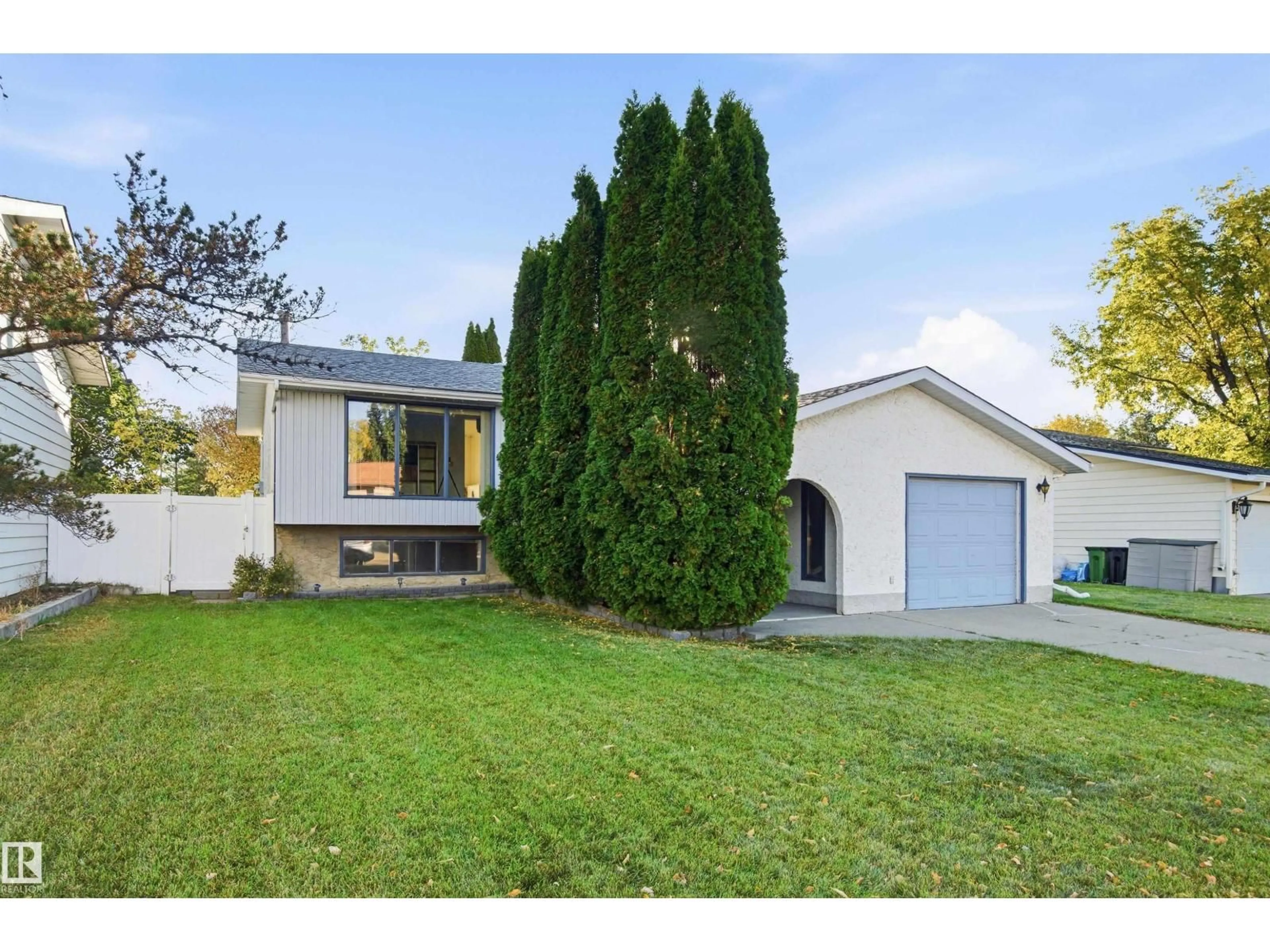 Home with vinyl exterior material, street for 3143 78 ST, Edmonton Alberta T6K3P1