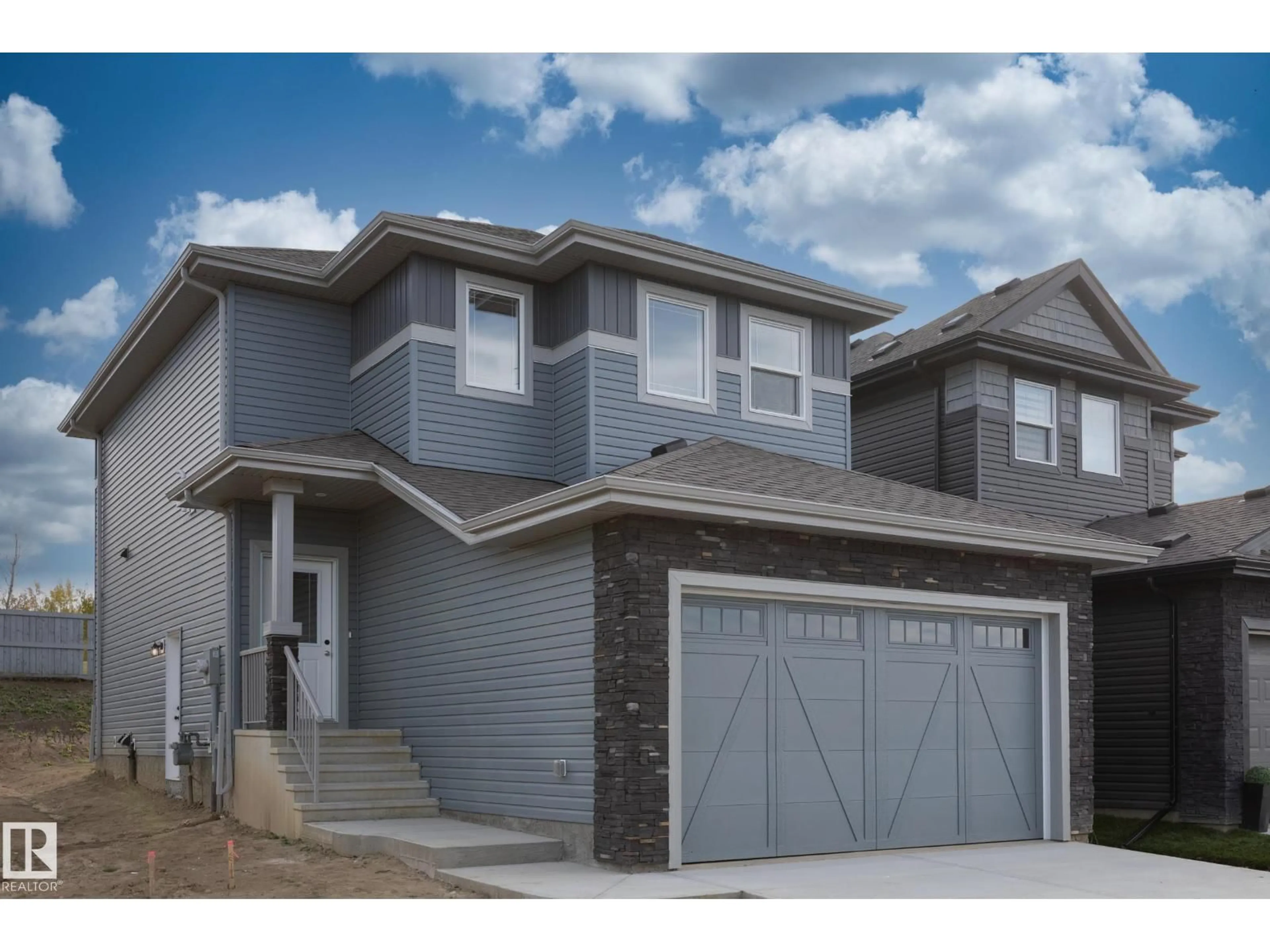 Home with vinyl exterior material, street for 93 SILVERSTONE DR, Stony Plain Alberta T7Z0E8
