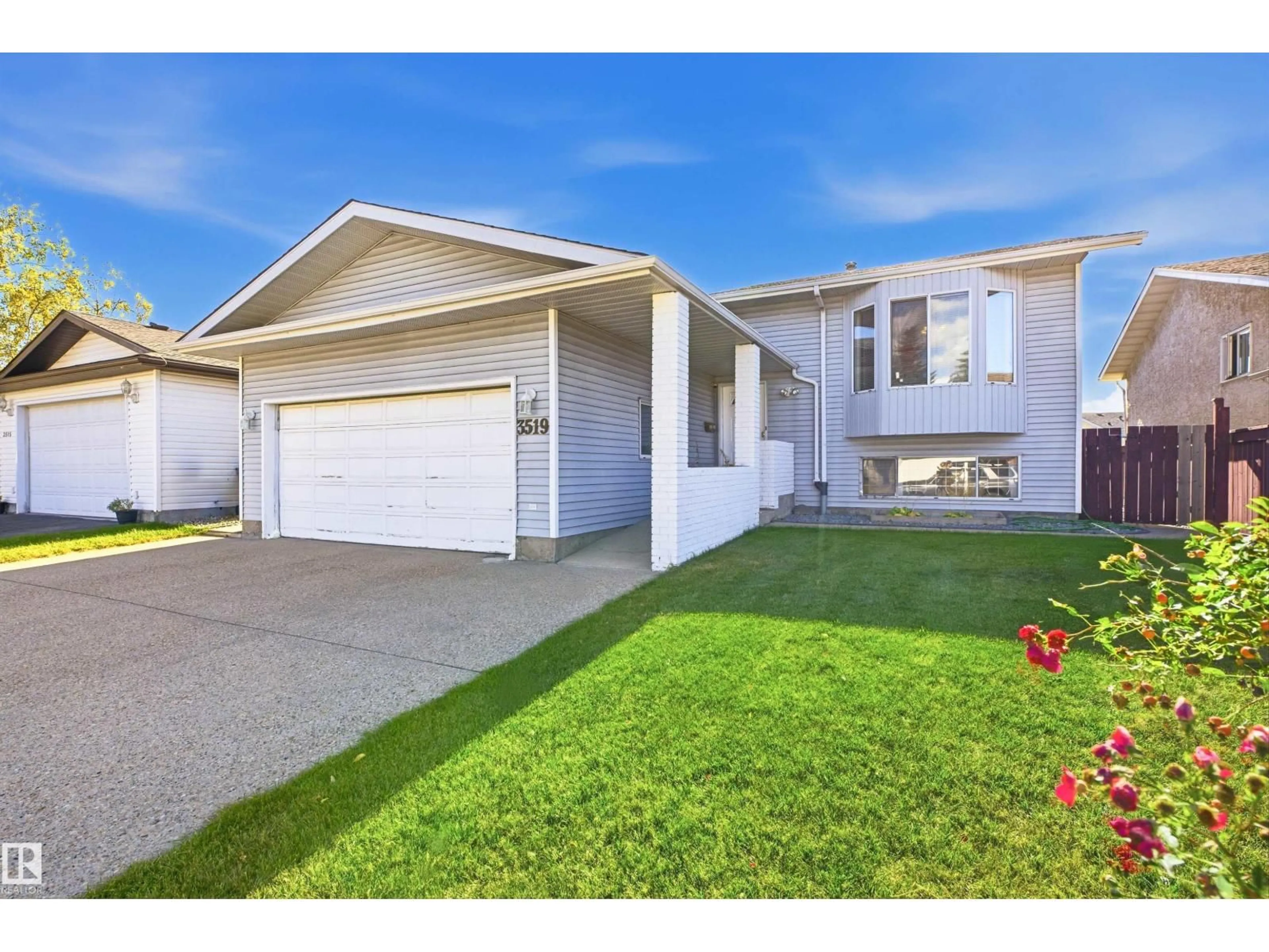 Home with vinyl exterior material, street for 3519 33 AV, Edmonton Alberta T6L4N6