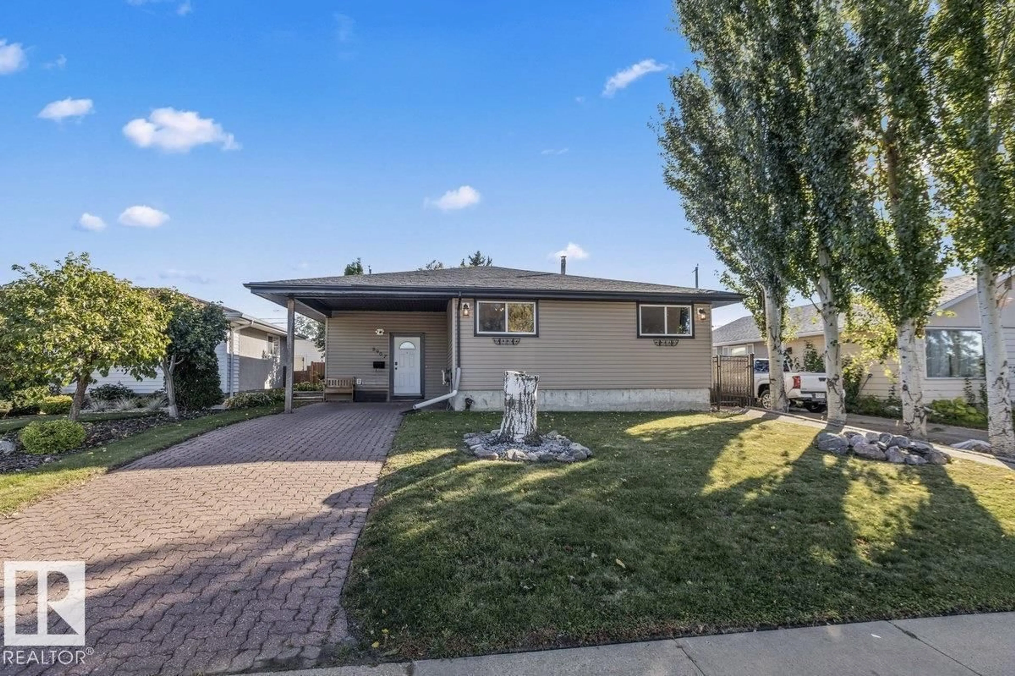 Home with vinyl exterior material, street for 8907 136 AV, Edmonton Alberta T5E1V5