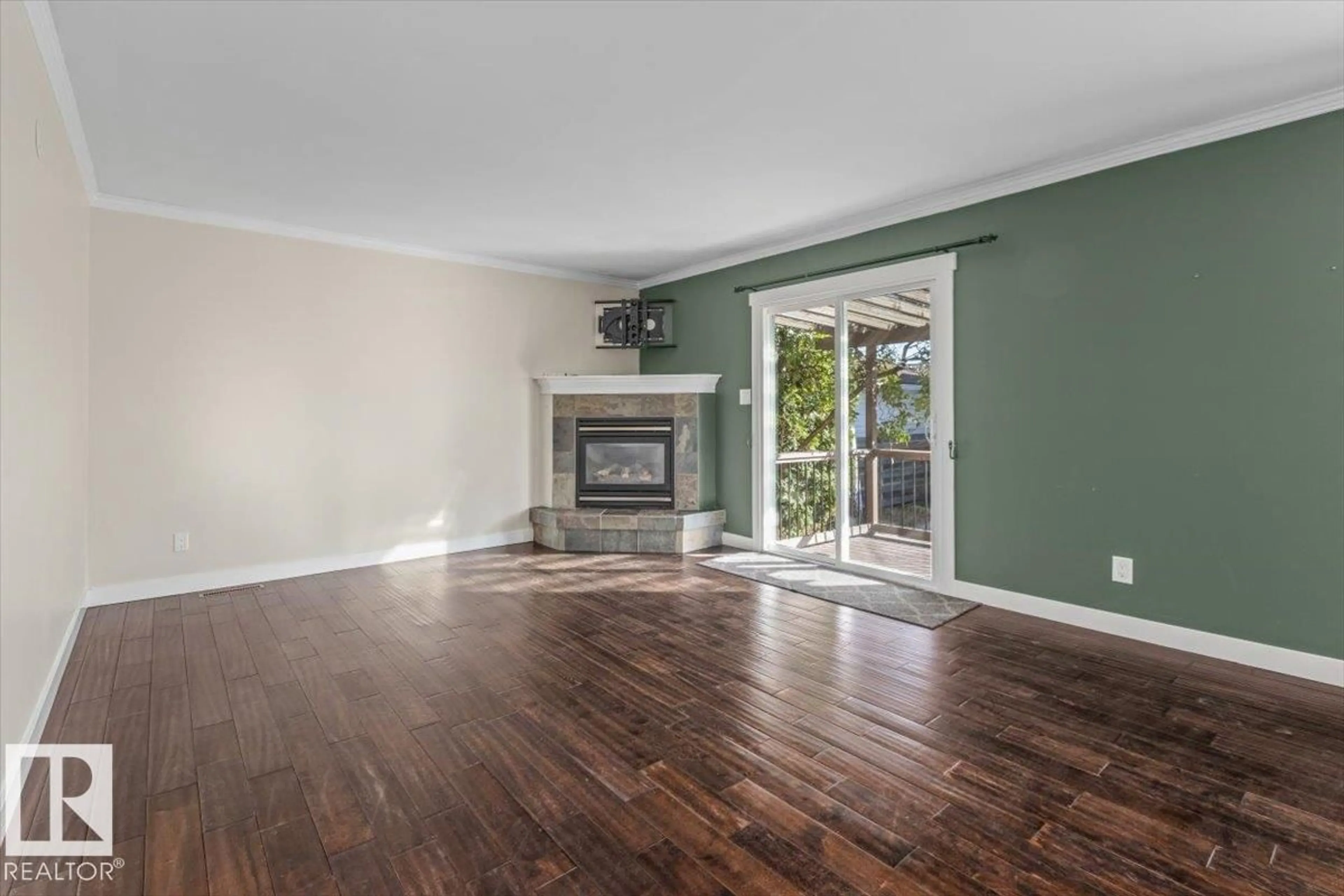Living room with furniture, wood/laminate floor for 8907 136 AV, Edmonton Alberta T5E1V5