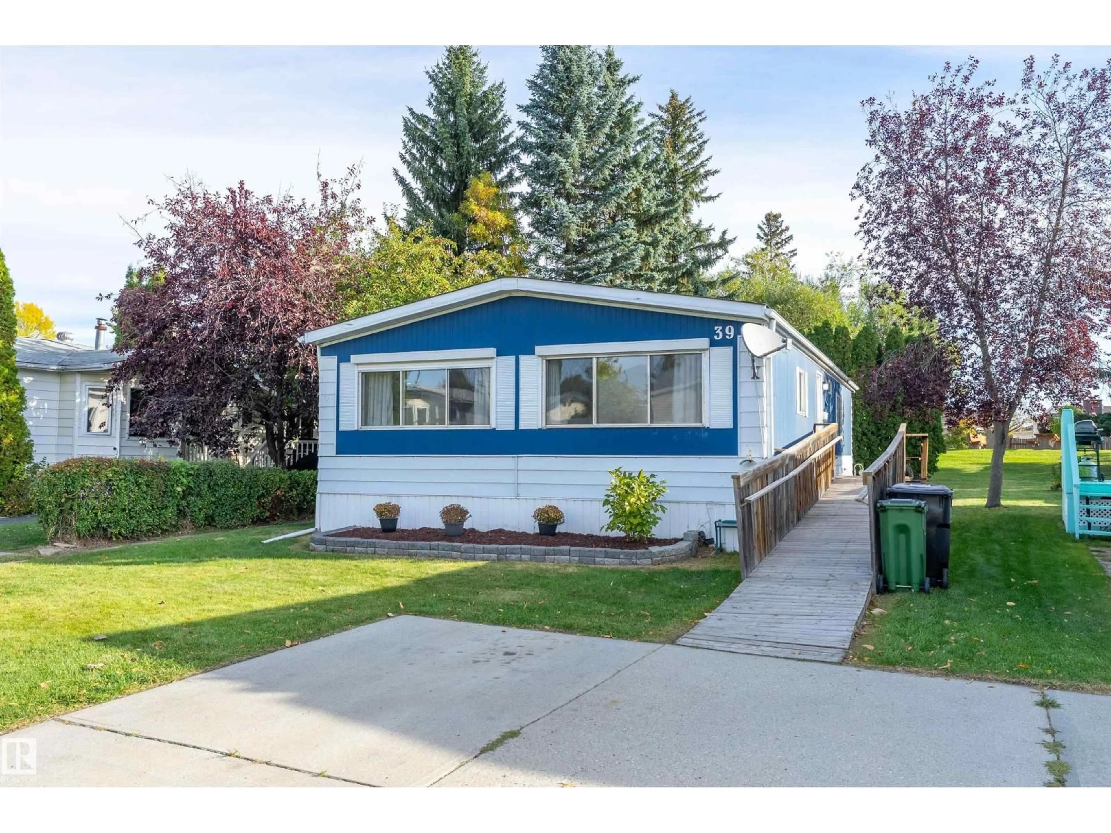 Home with vinyl exterior material, street for 39 12604 153 AV NW, Edmonton Alberta T5X4M7