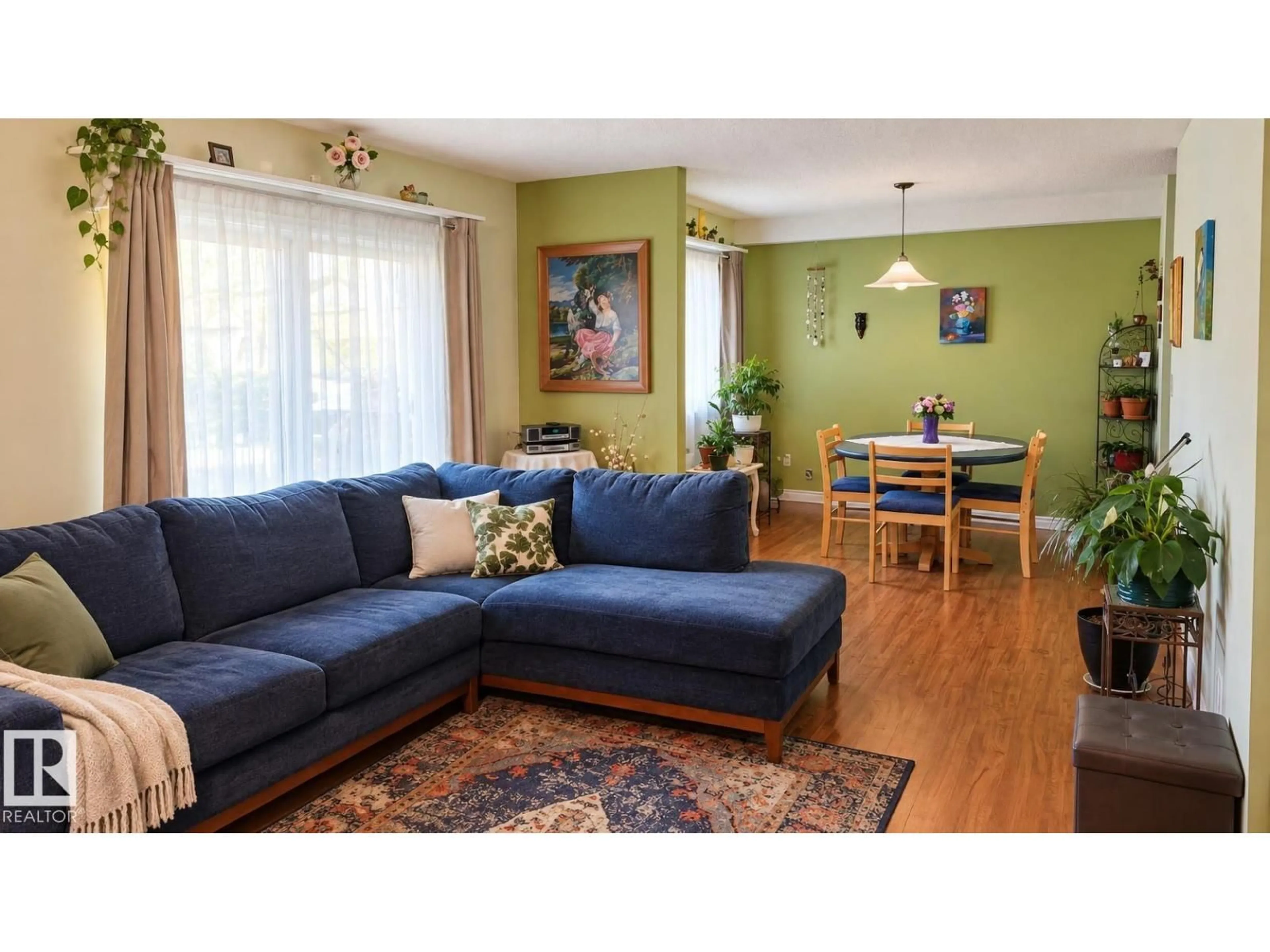 Living room with furniture, wood/laminate floor for 109 - 10838 108 ST, Edmonton Alberta T5H3A6