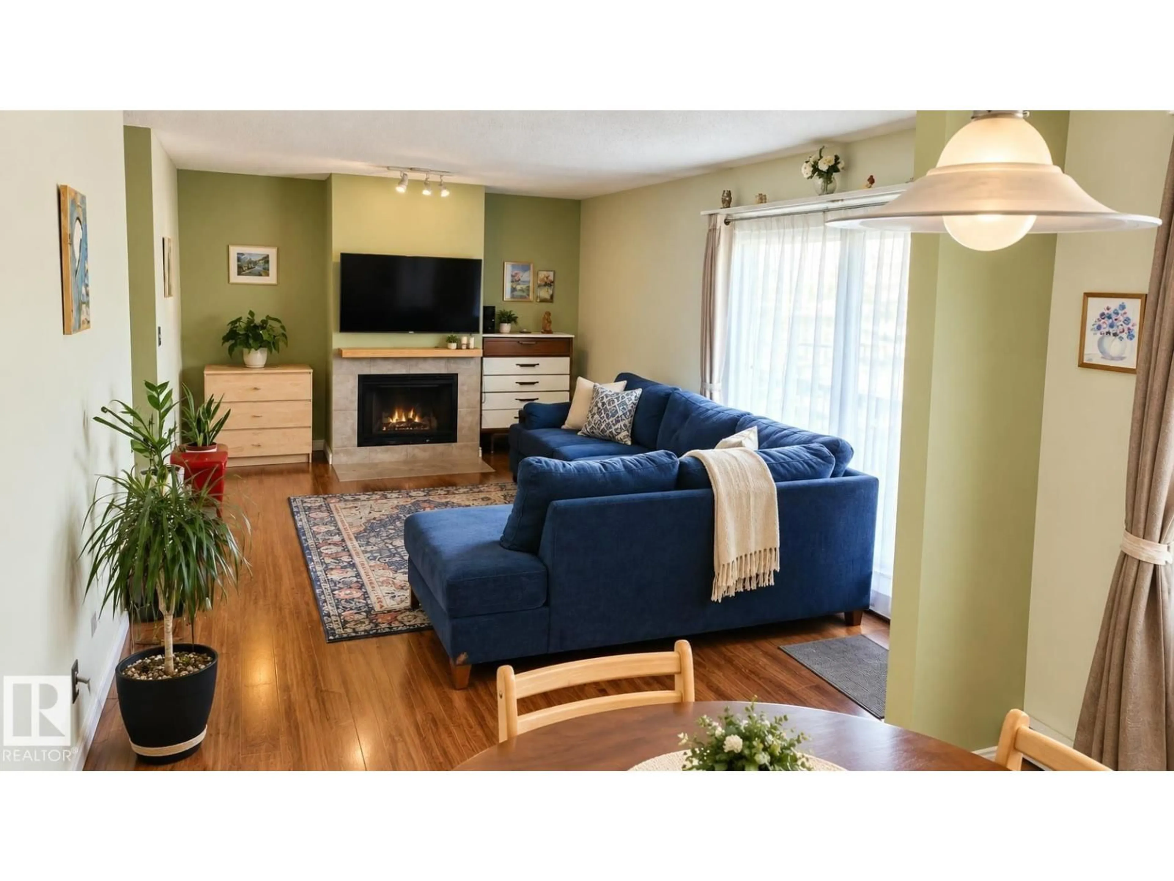 Living room with furniture, wood/laminate floor for 109 - 10838 108 ST, Edmonton Alberta T5H3A6