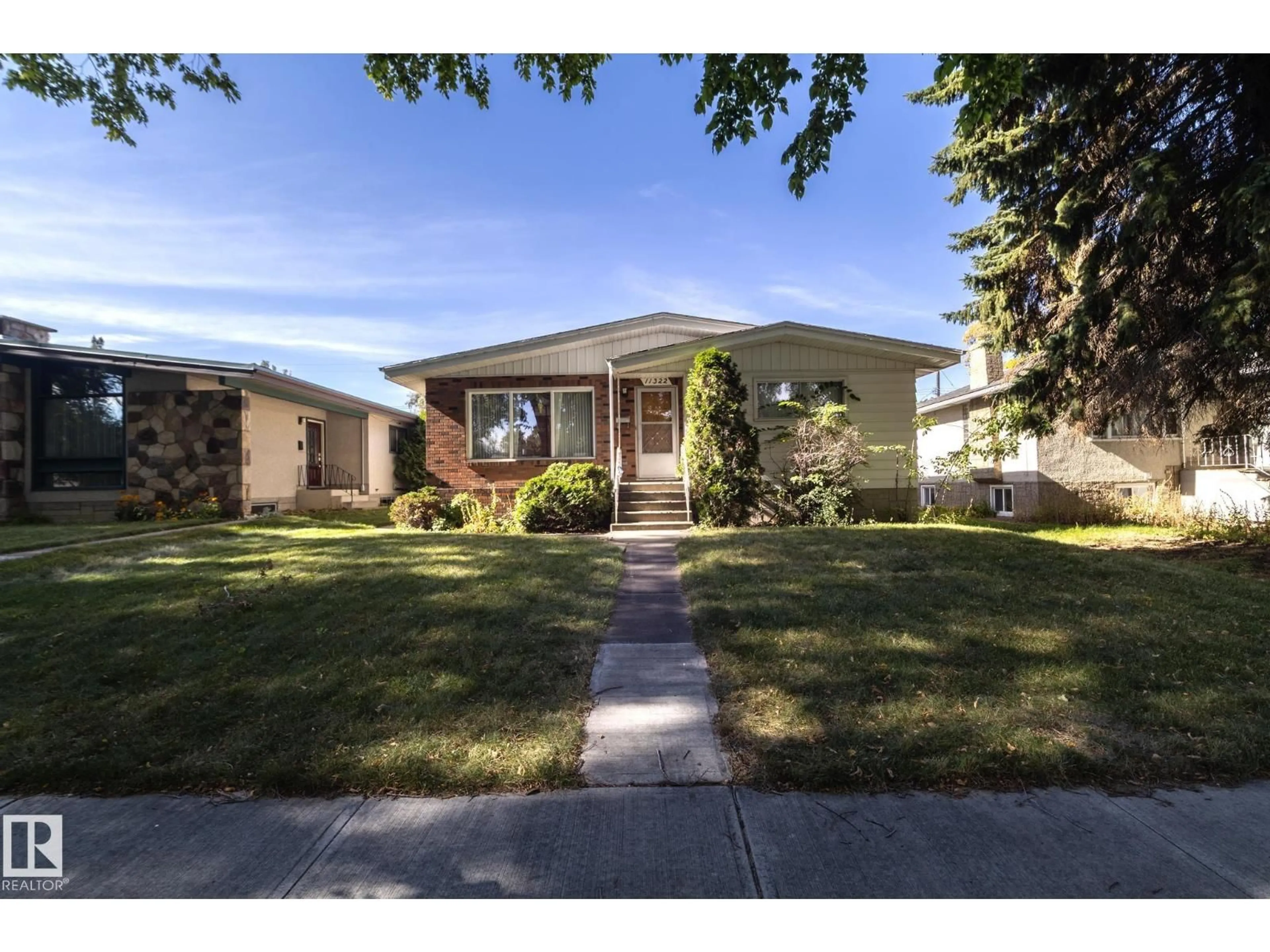Home with brick exterior material, street for 11322 52 ST, Edmonton Alberta T5W3J1