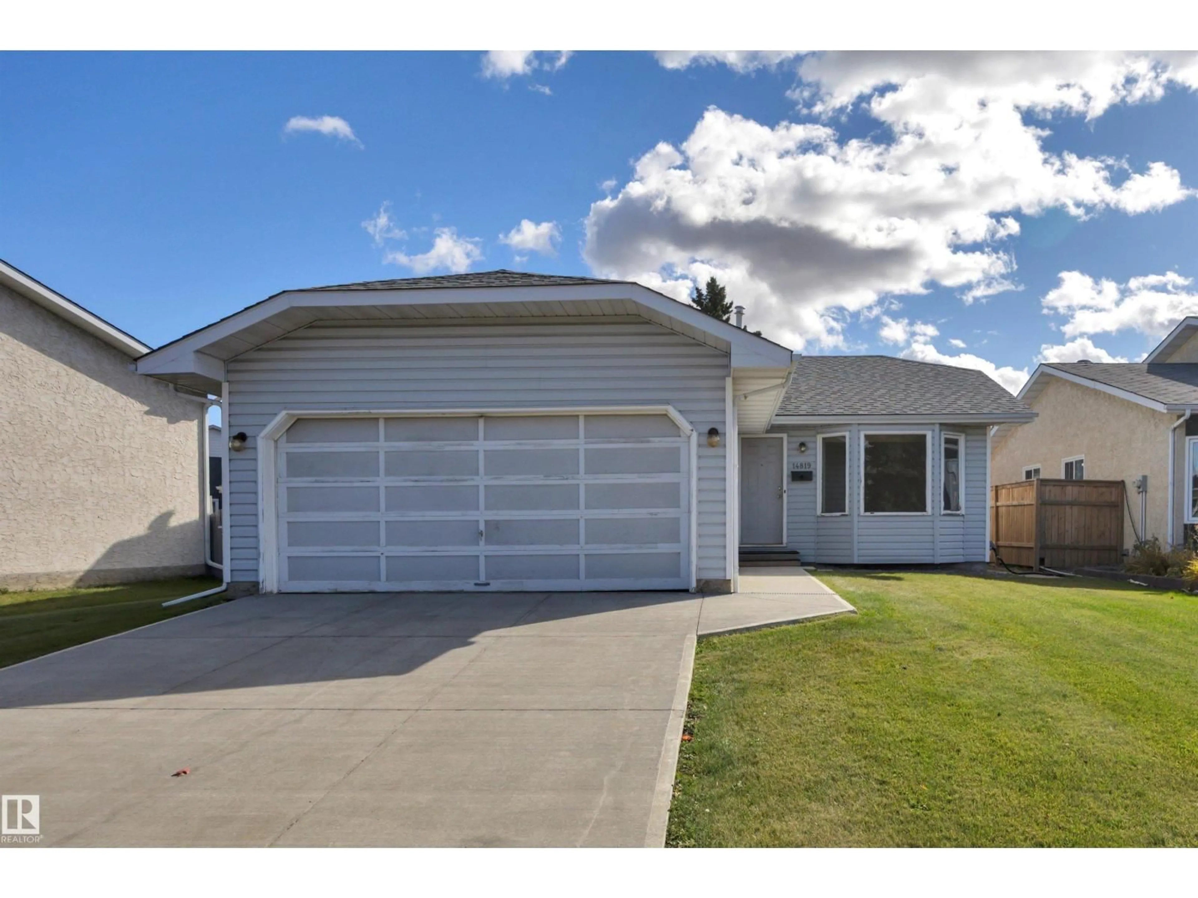 Home with vinyl exterior material, street for 14819 35 ST, Edmonton Alberta T5Y2H8