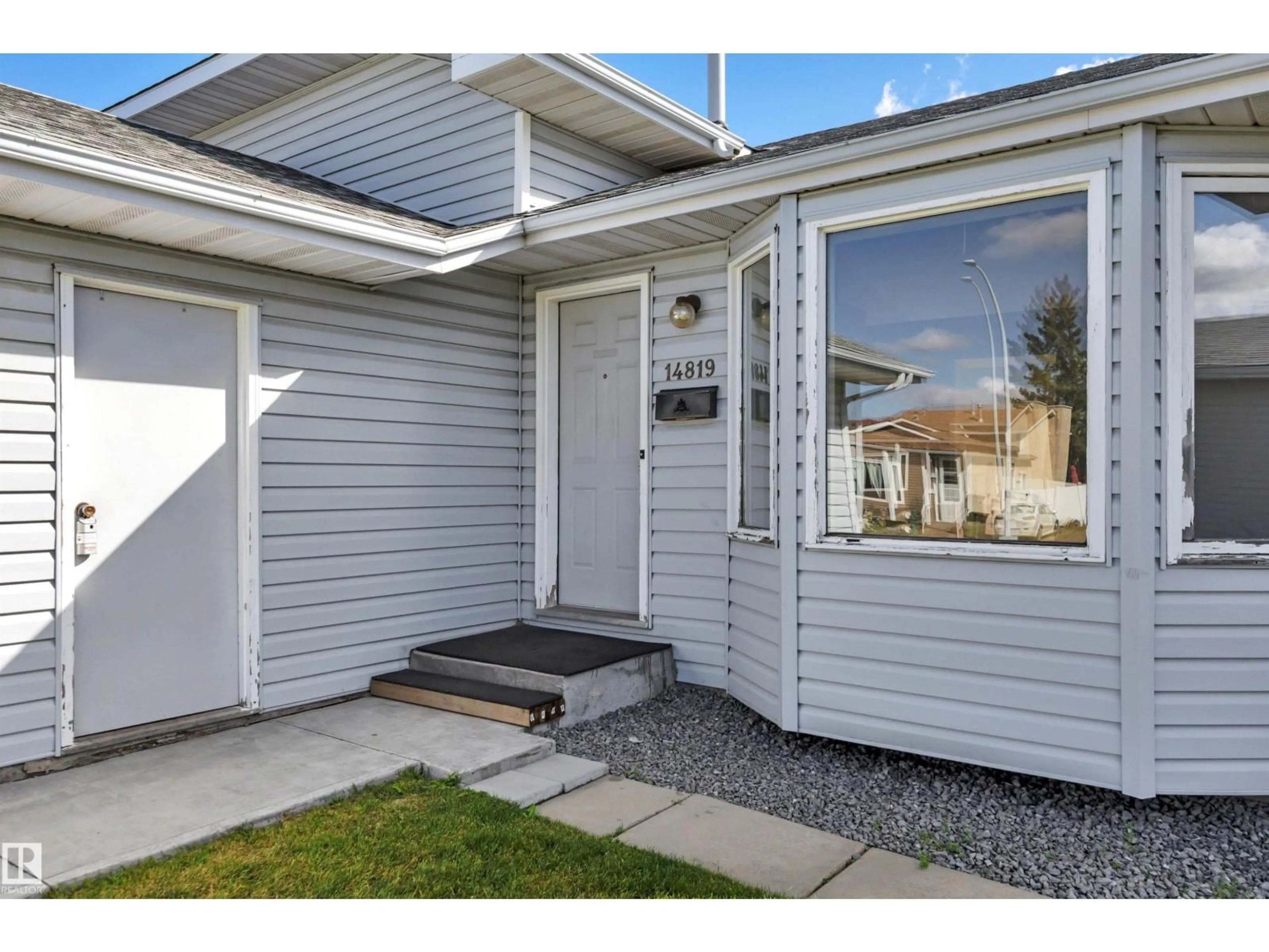 Home with vinyl exterior material, street for 14819 35 ST, Edmonton Alberta T5Y2H8