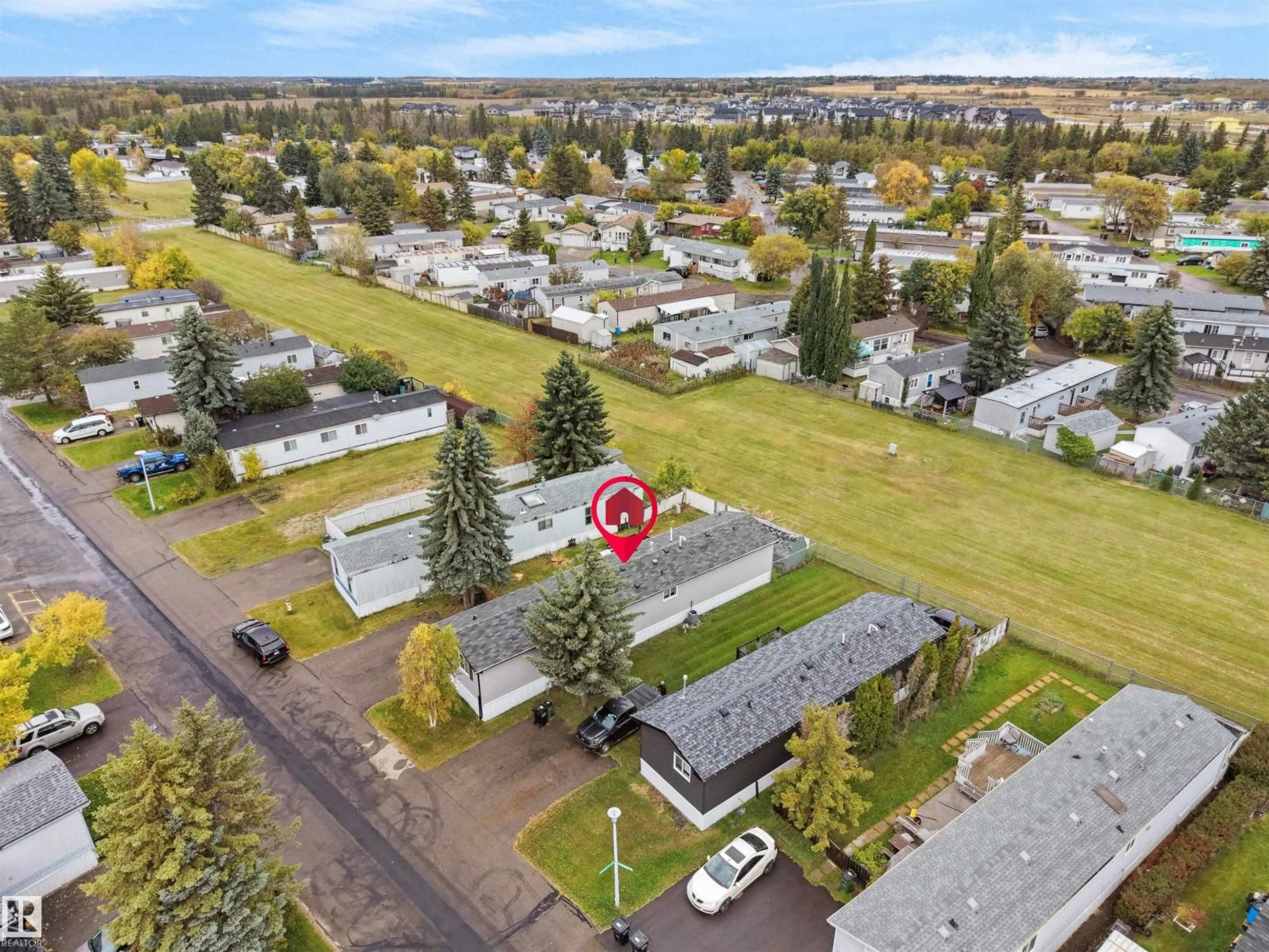A pic from outside/outdoor area/front of a property/back of a property/a pic from drone, mountain view for 52 EVERGREEN PARK NW, Edmonton Alberta T5Y4M2