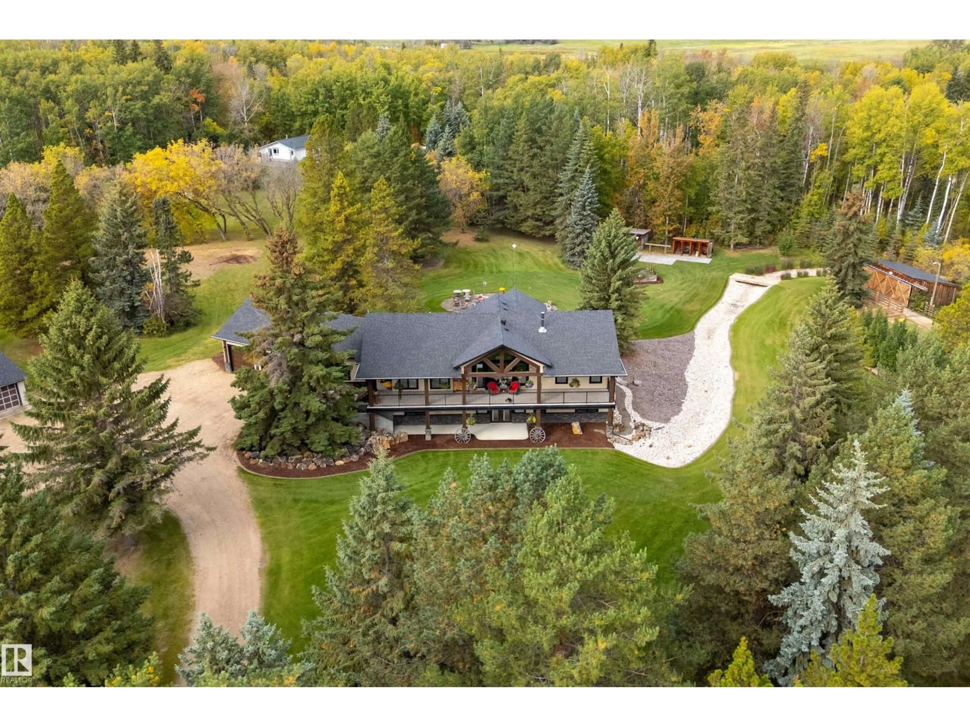 A pic from outside/outdoor area/front of a property/back of a property/a pic from drone, mountain view for 54500 - 134 LAC STE ANNE, Rural Sturgeon County Alberta T8R1Z1