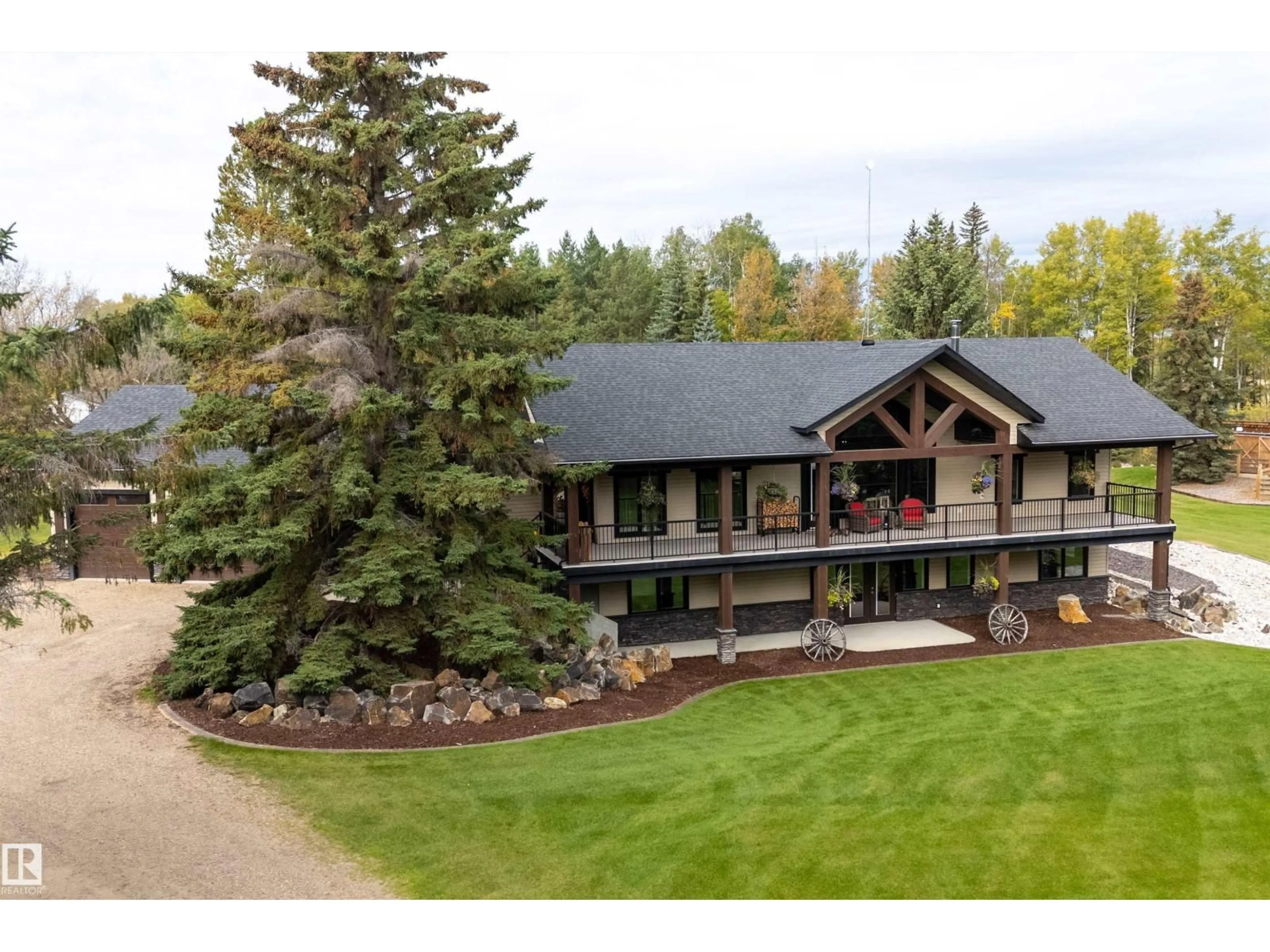 A pic from outside/outdoor area/front of a property/back of a property/a pic from drone, mountain view for 54500 - 134 LAC STE ANNE, Rural Sturgeon County Alberta T8R1Z1
