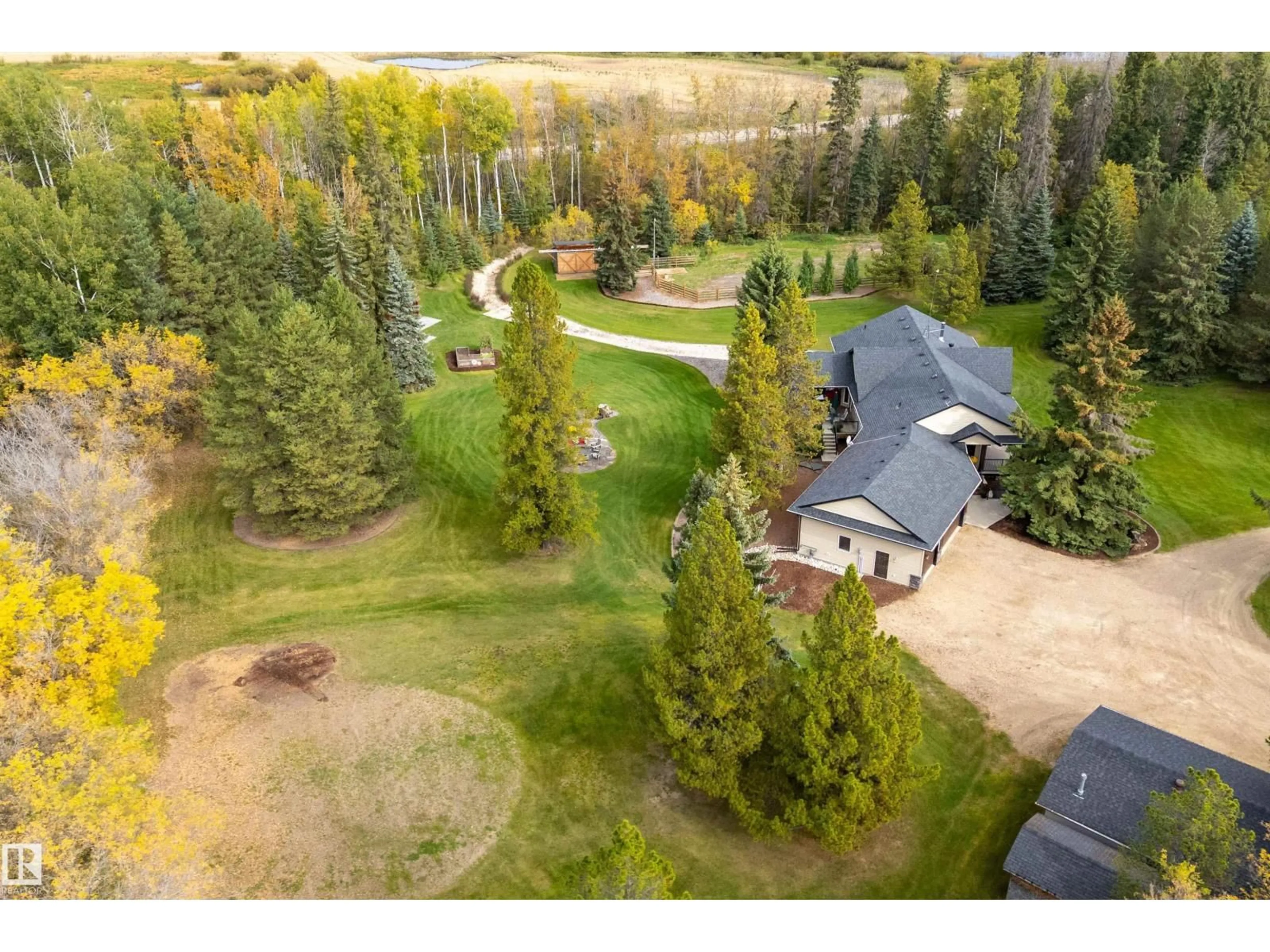 A pic from outside/outdoor area/front of a property/back of a property/a pic from drone, forest/trees view for 54500 - 134 LAC STE ANNE, Rural Sturgeon County Alberta T8R1Z1