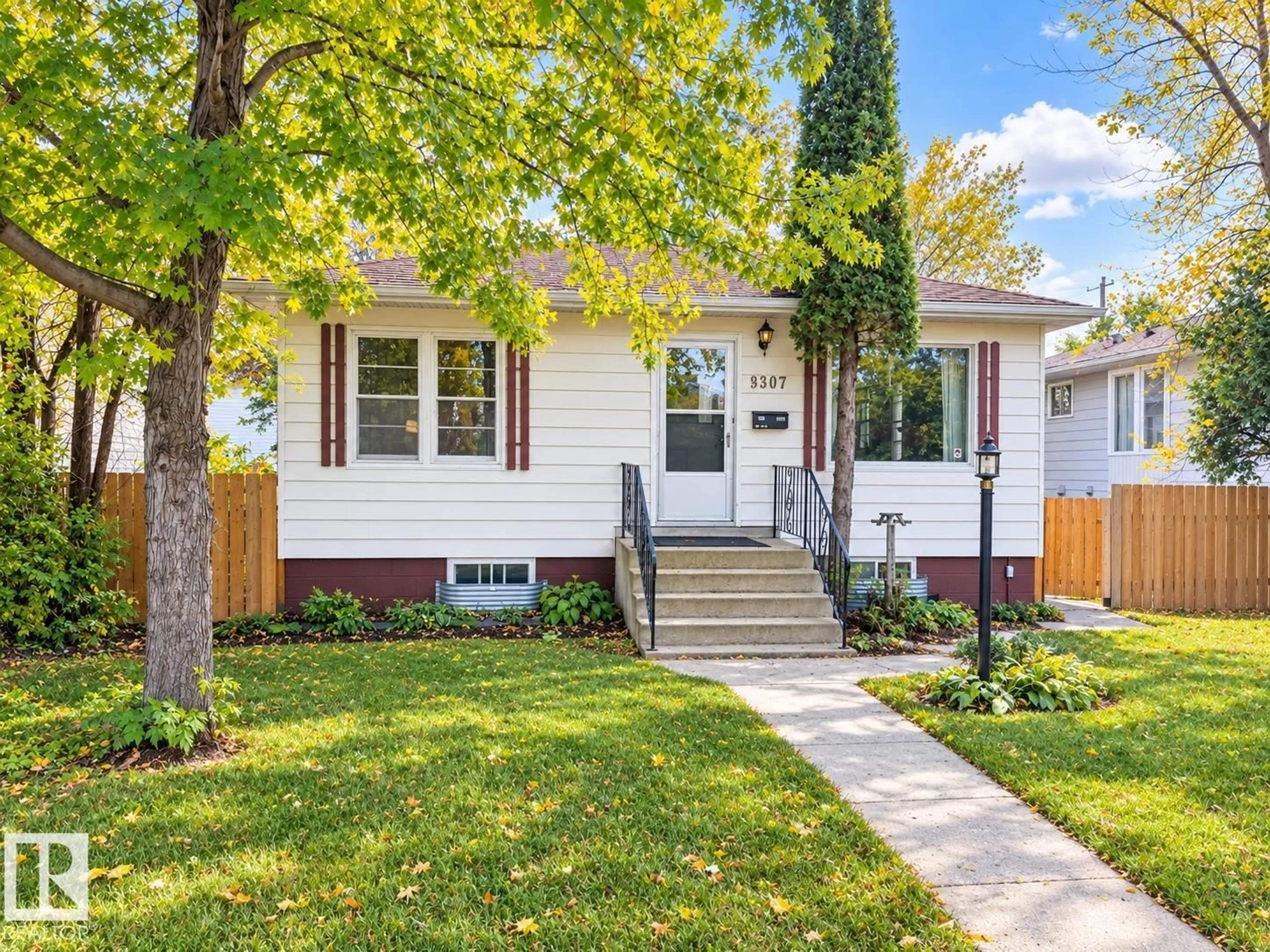 Home with vinyl exterior material, street for 8907 83 AV NW, Edmonton Alberta T6C1B4