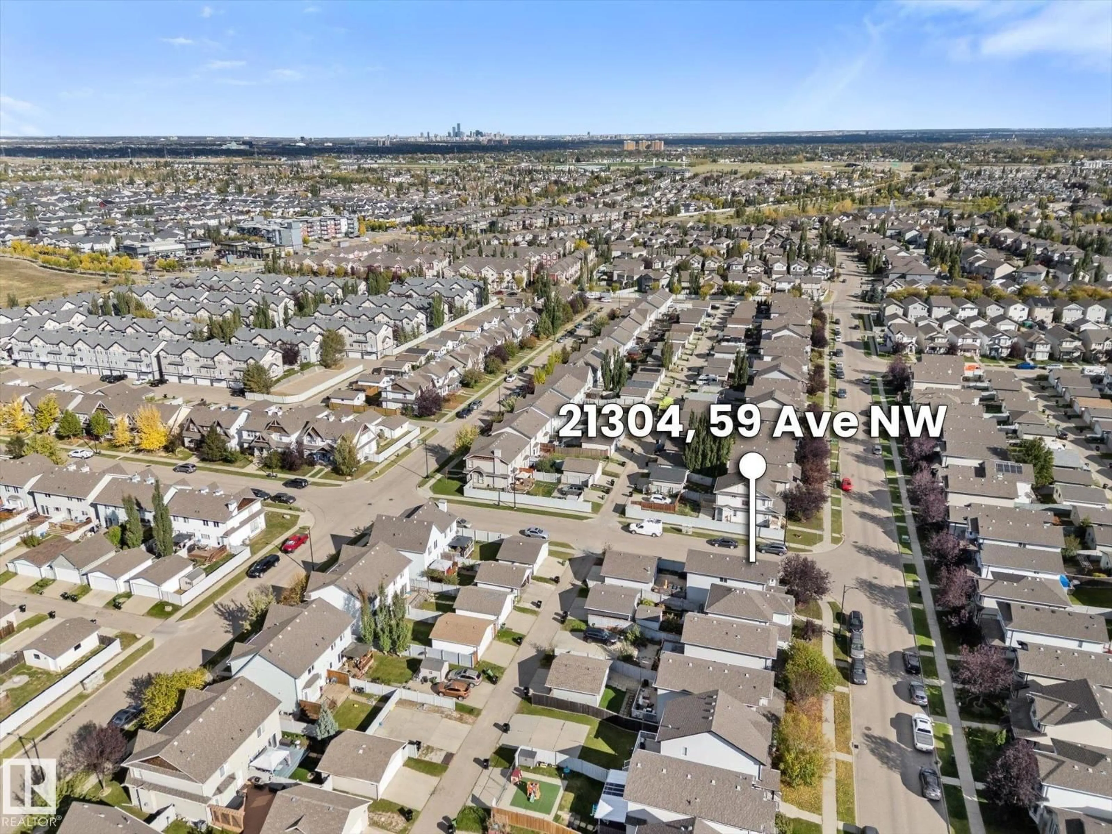 A pic from outside/outdoor area/front of a property/back of a property/a pic from drone, unknown for NW - 21304 59 AV, Edmonton Alberta T6M0H5