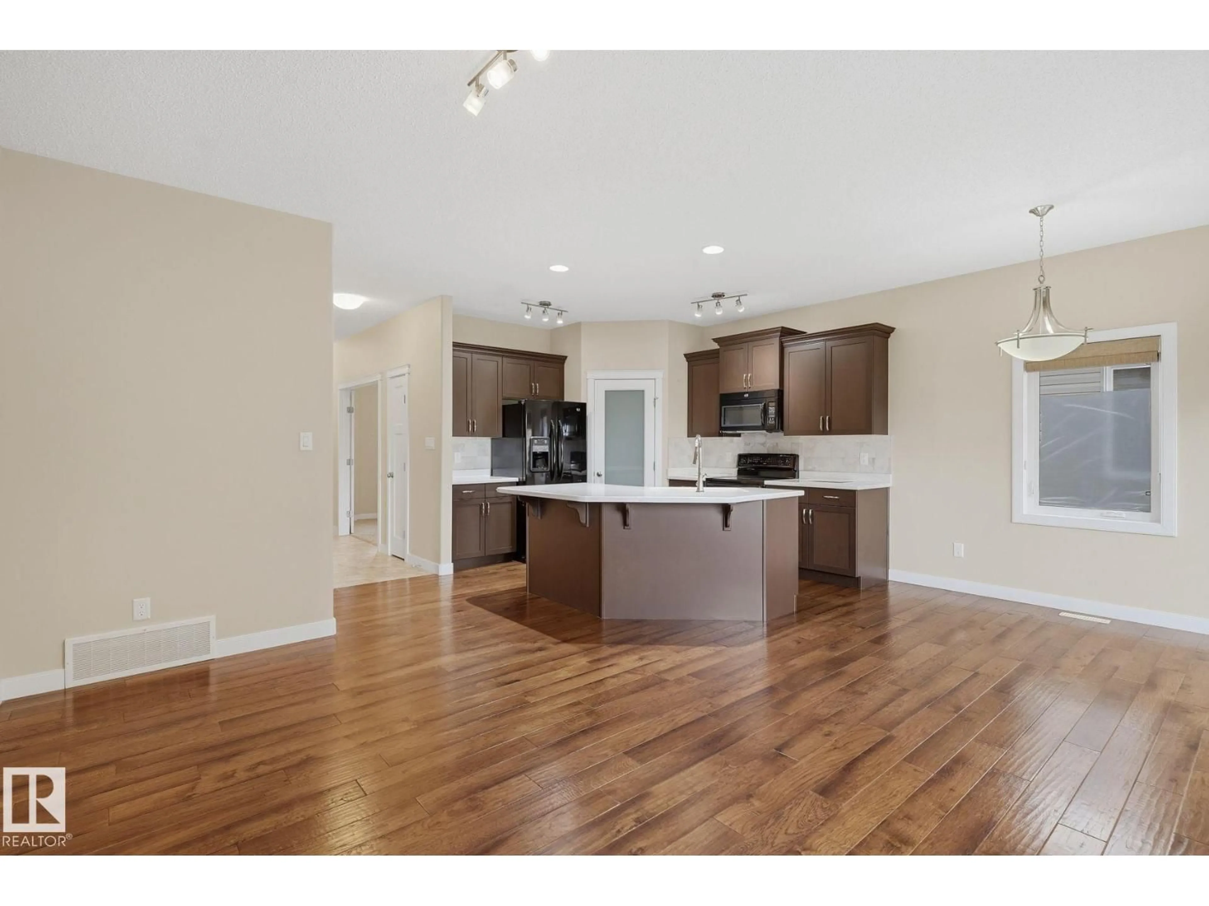 Open concept kitchen, wood/laminate floor for 19 340 SPRUCE RIDGE RD, Spruce Grove Alberta T7X0J4