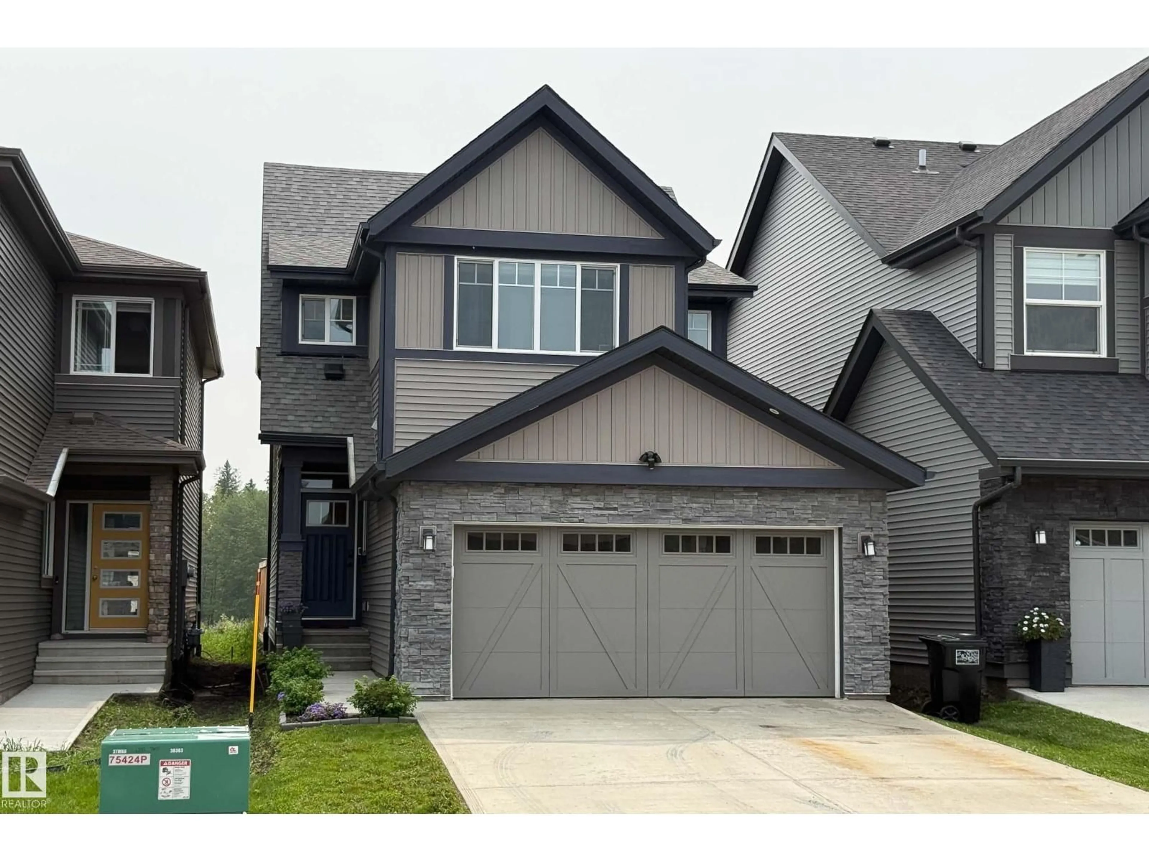 Home with vinyl exterior material, street for 21035 128 AV, Edmonton Alberta T5S0R5