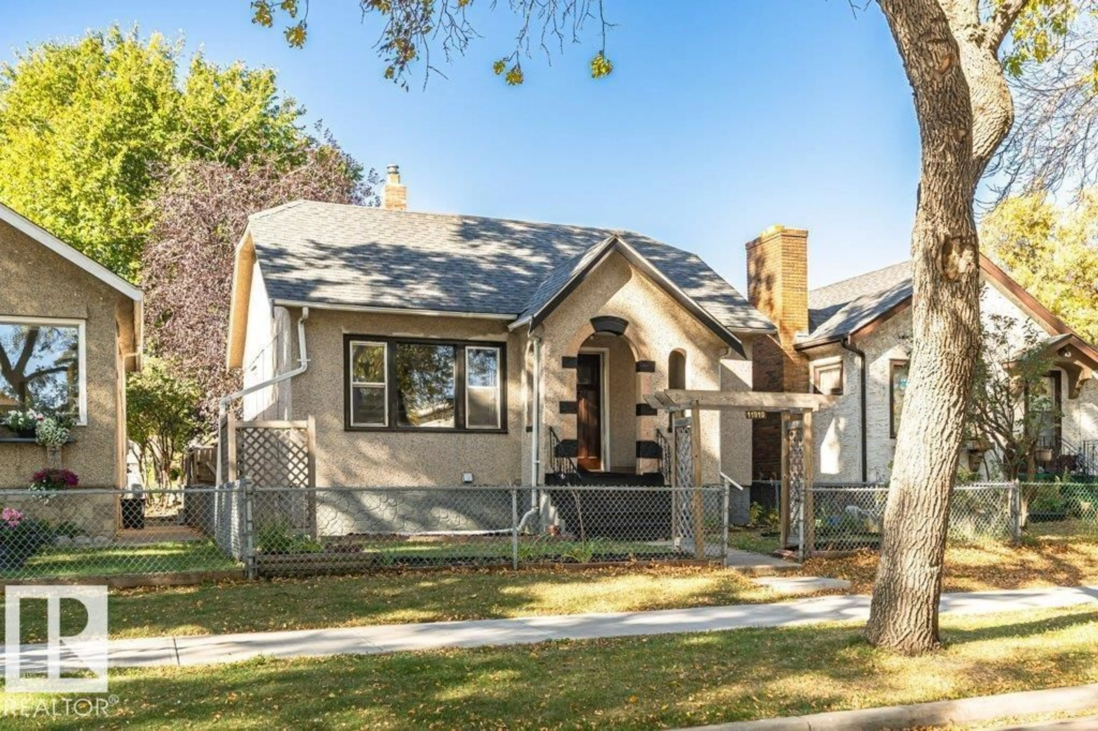 Home with brick exterior material, street for 11910 94 ST, Edmonton Alberta T5G1J5