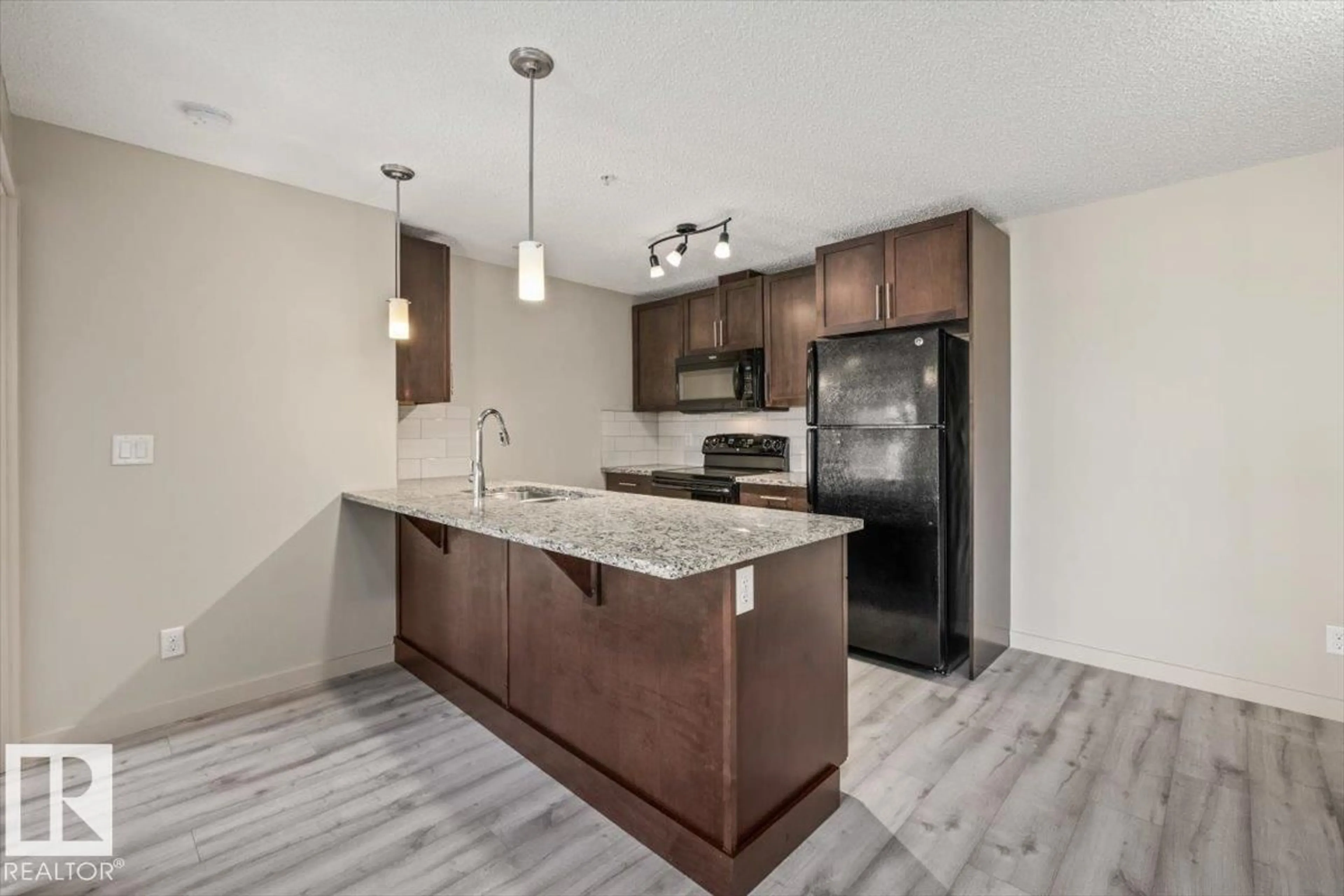 Open concept kitchen, unknown for 230 6076 SCHONSEE WY, Edmonton Alberta T5Z0K8