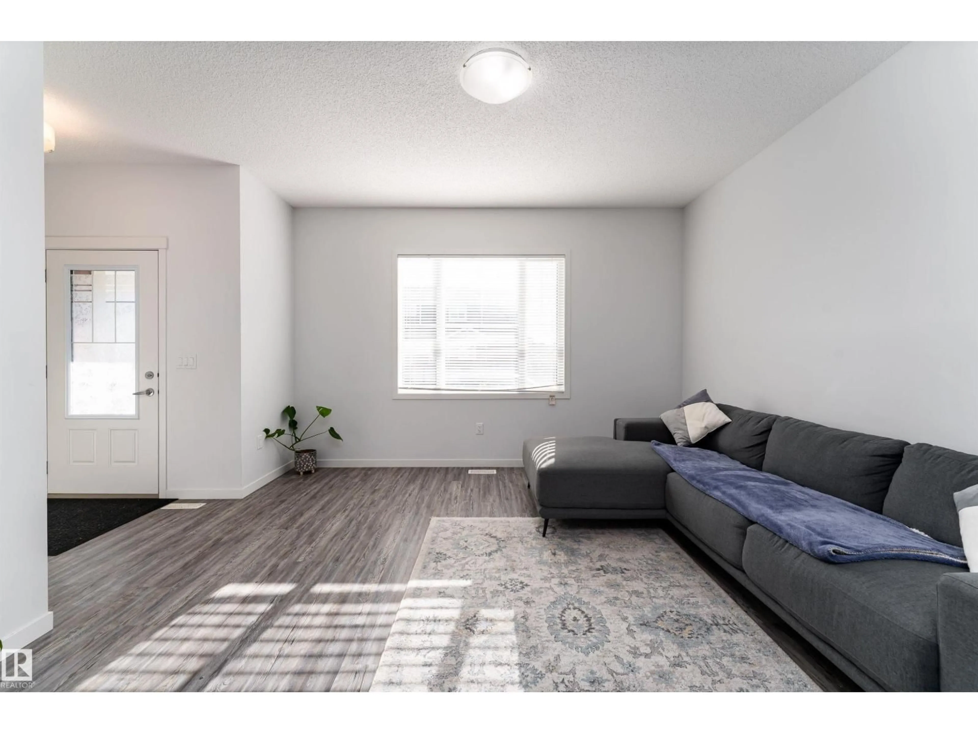 Living room with furniture, unknown for 577 EBBERS WY, Edmonton Alberta T5Y3T8