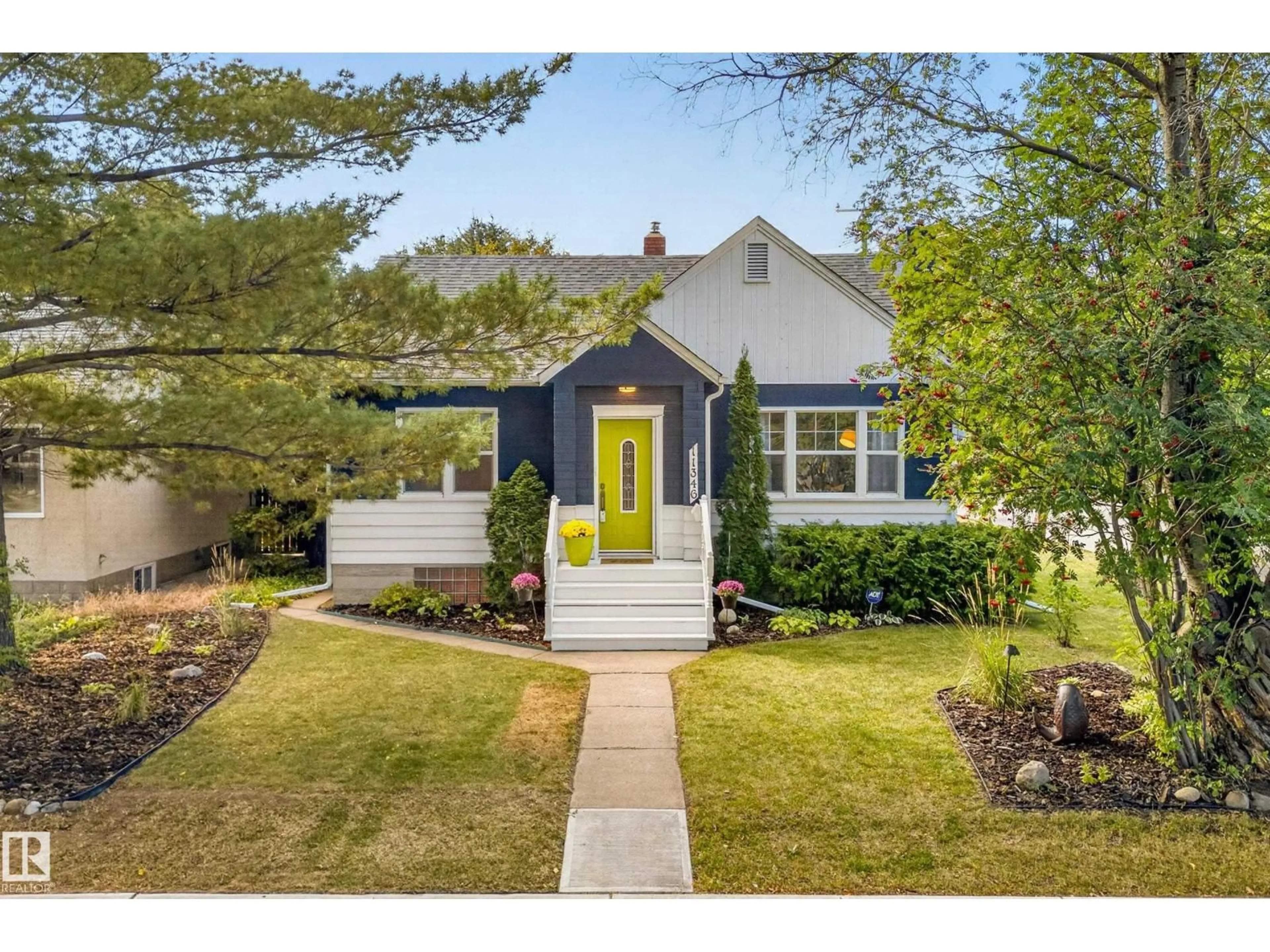 Home with vinyl exterior material, street for 11346 69 ST, Edmonton Alberta T5B1R7