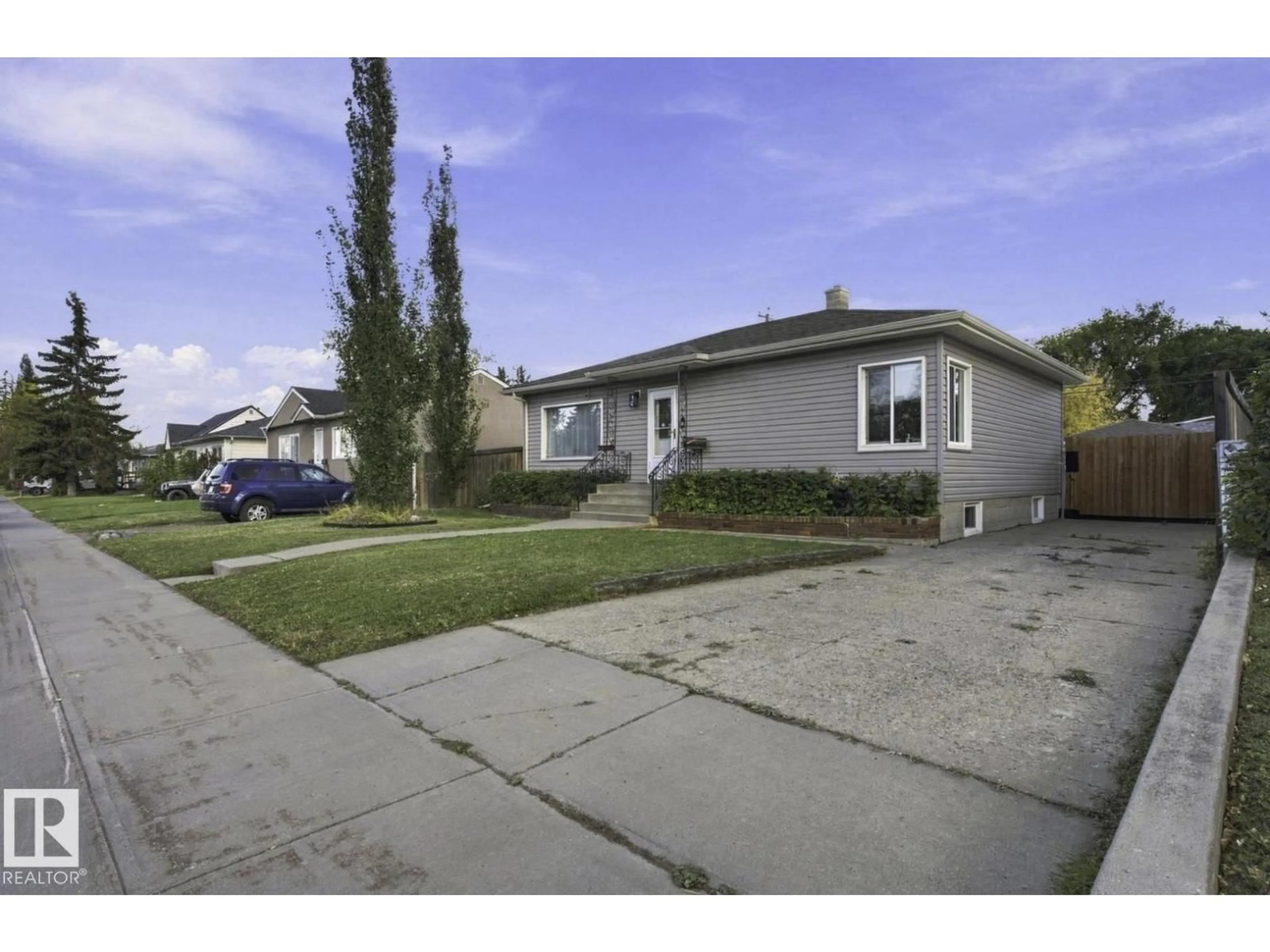 Home with vinyl exterior material, street for NW - 11928 127 ST, Edmonton Alberta T5L0Z1