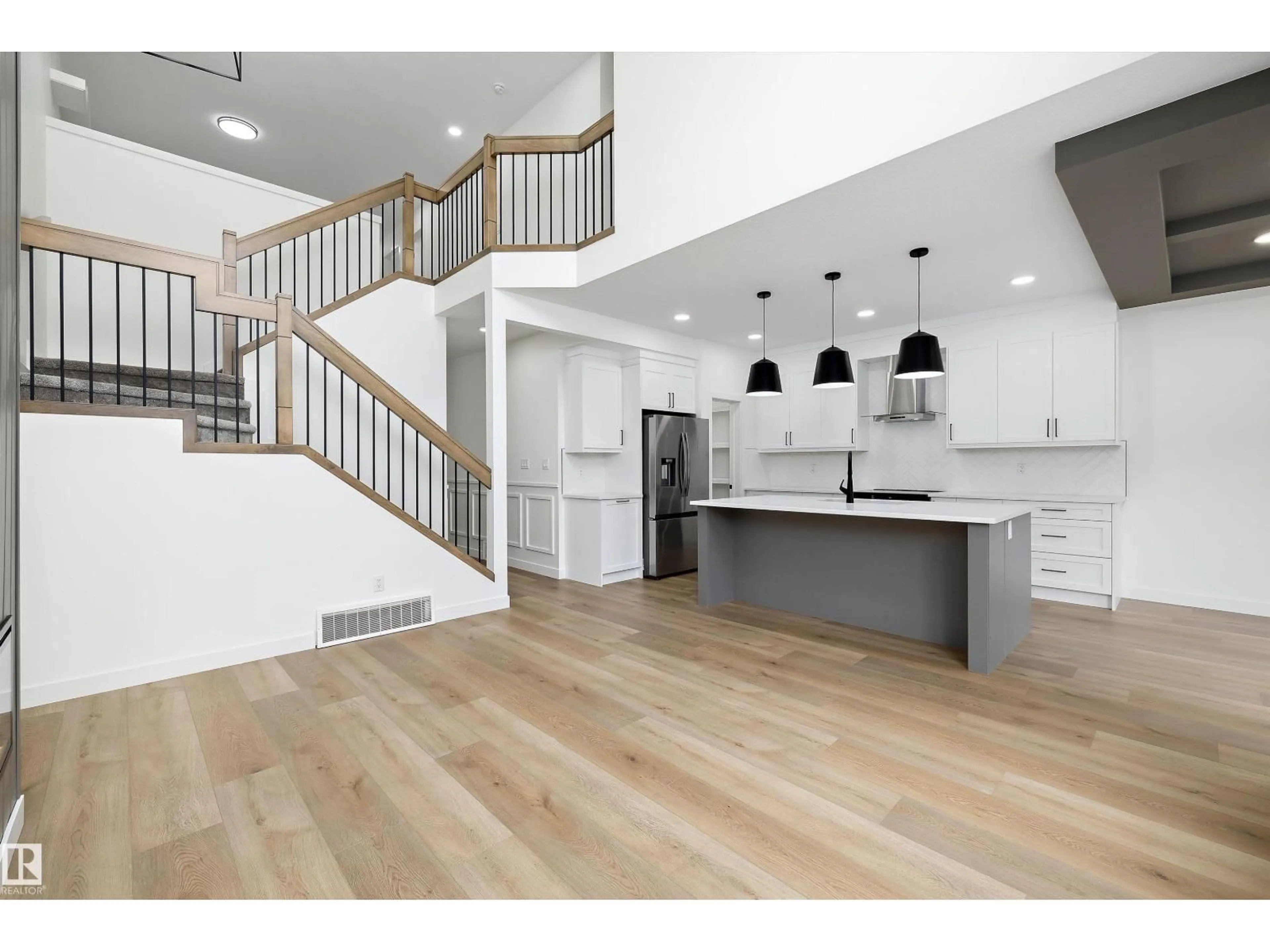 Open concept kitchen, wood/laminate floor for 915 ELDERBERRY LD, Edmonton Alberta T6M3K3