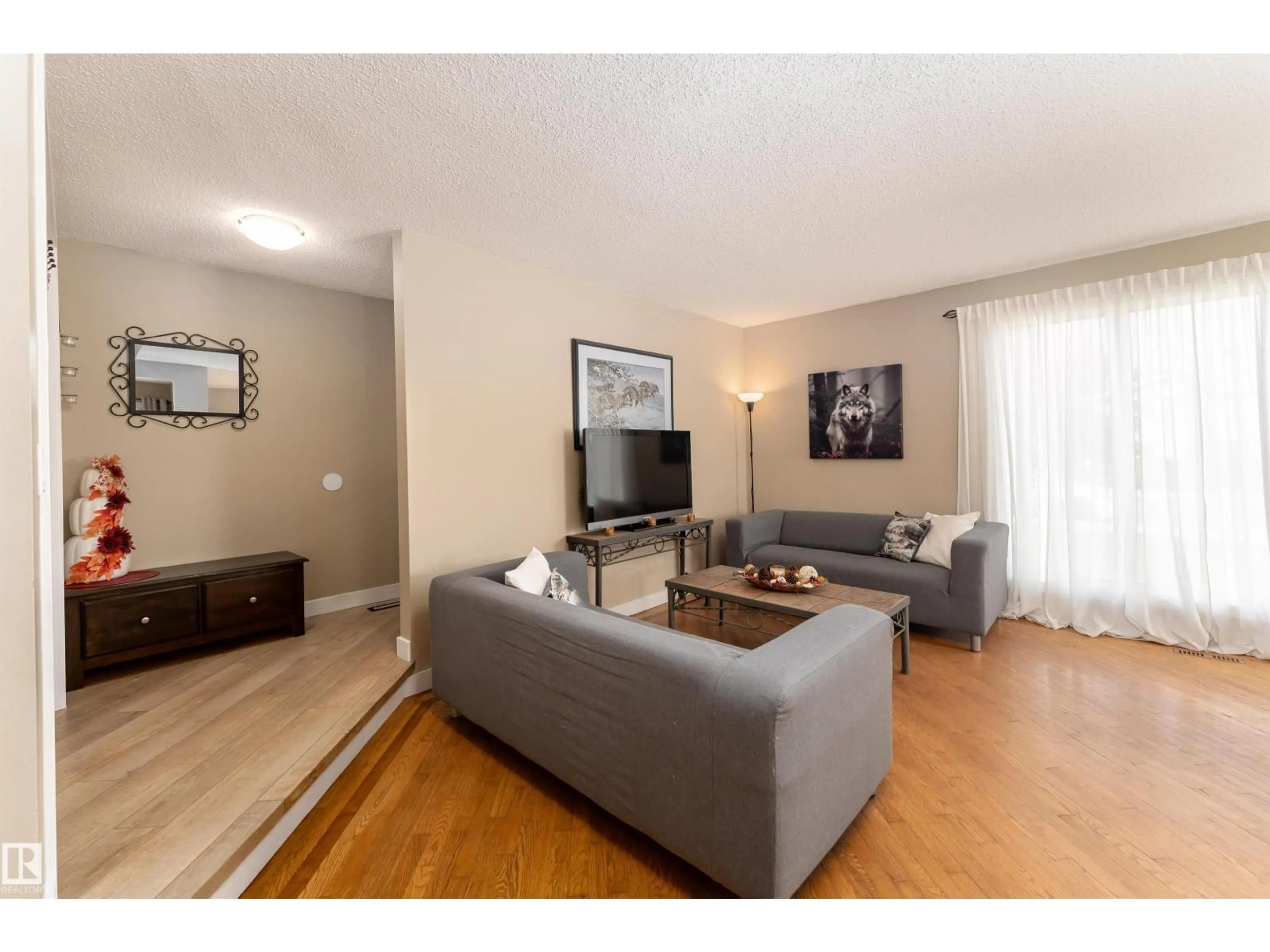 Living room with furniture, unknown for 6007 37 AV, Edmonton Alberta T6L1V3